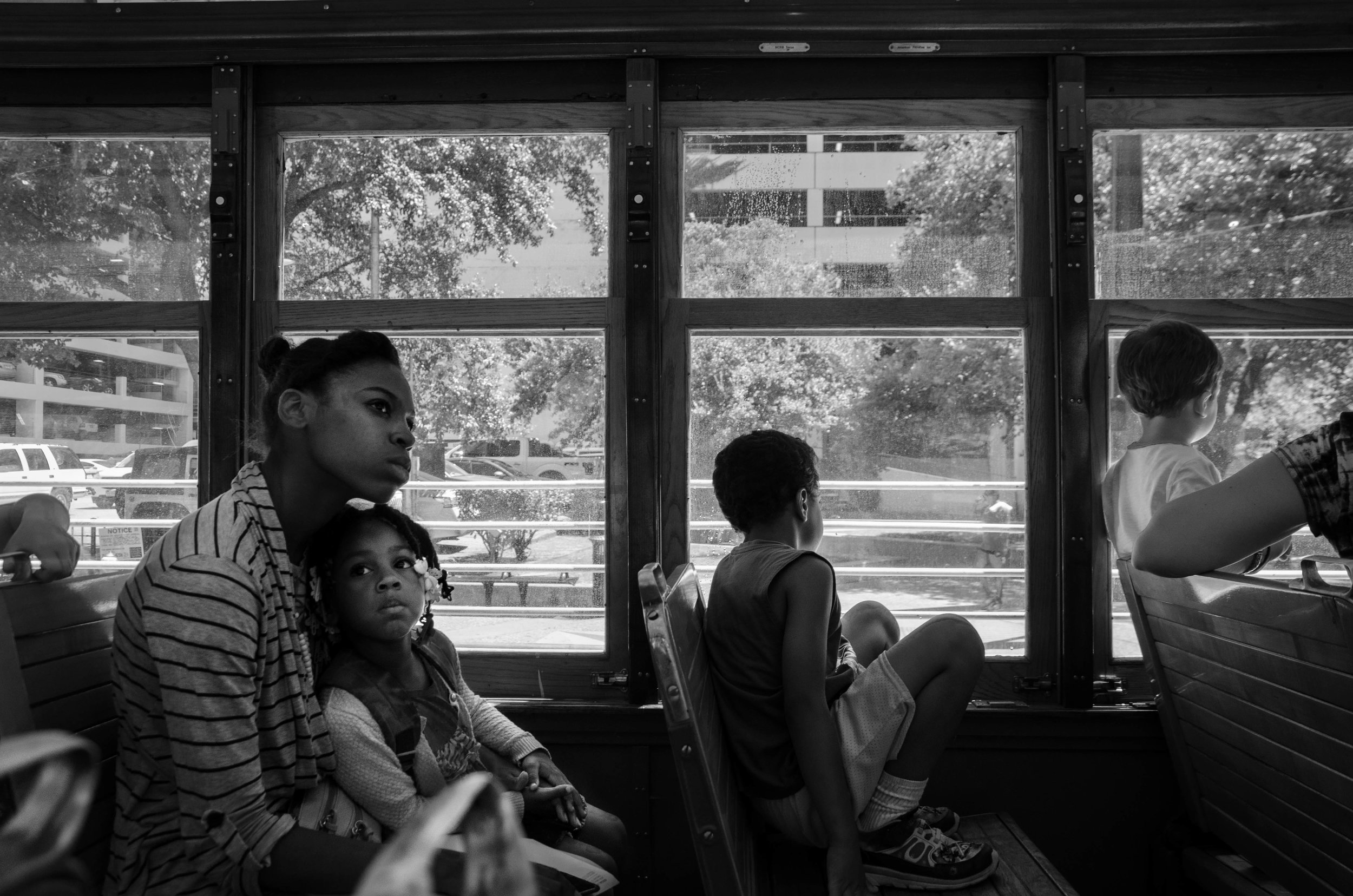  Two young women ride the trolley in Dallas, Texas. 