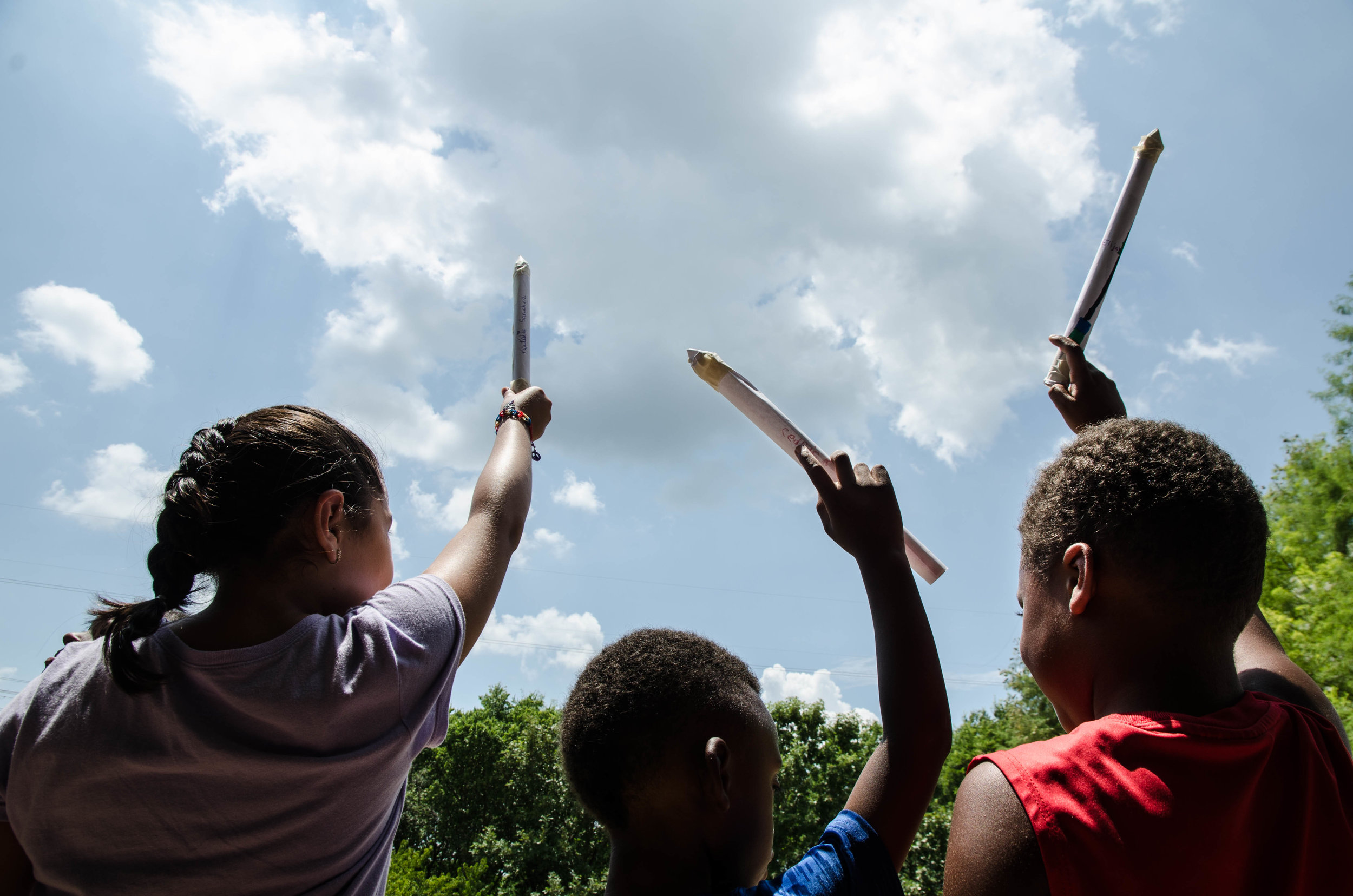  Young children imagine how high their paper rockets will go at the Perot Museum in Dallas, Texas. 