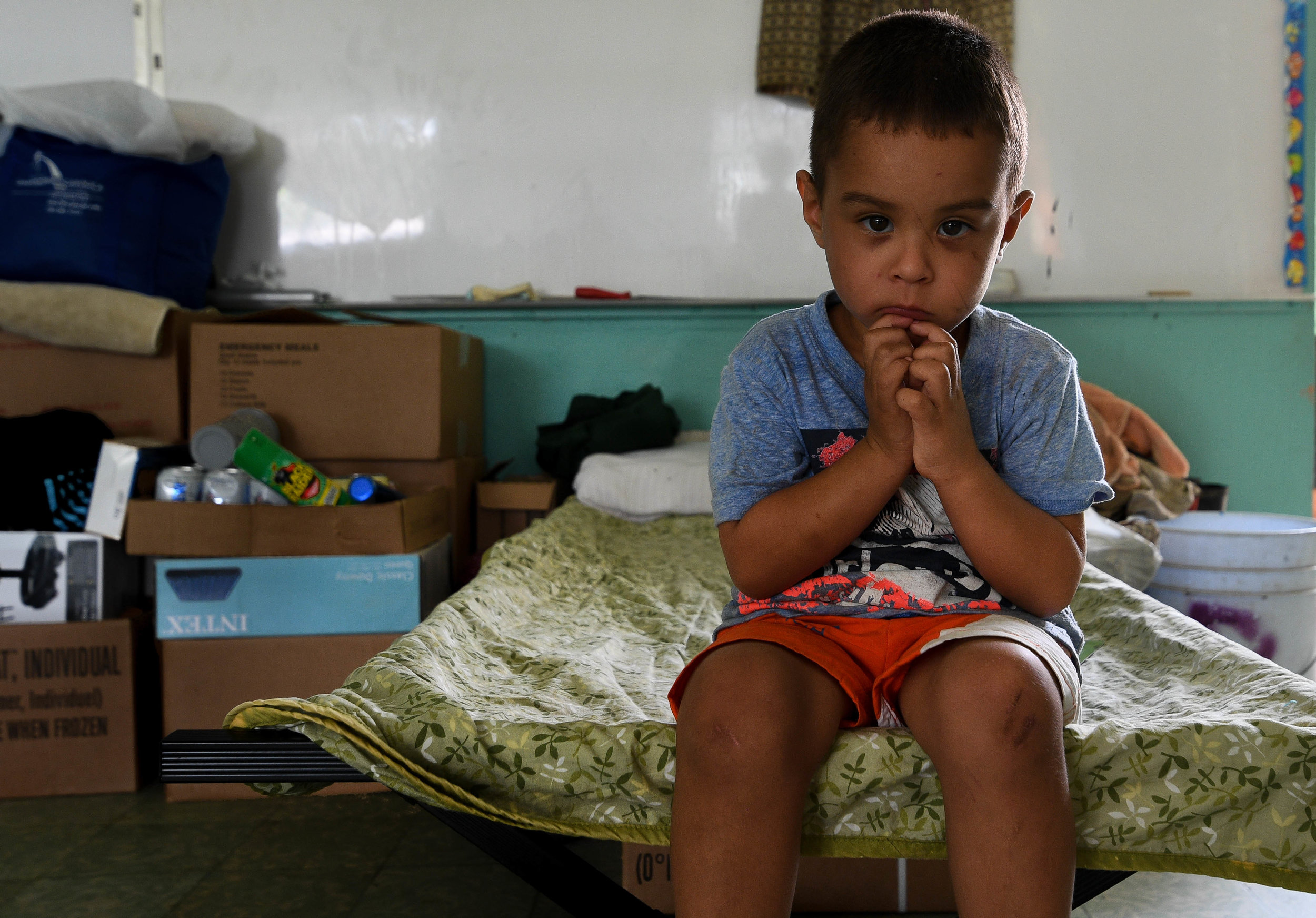    EXPAND   Five-year-old Jeyden Quinones isn't used to the food the military has given him. He wants plantains, his favorite food. Over the past few months, he and eight family members have been sharing one room and four beds in the cramped Jayuya s