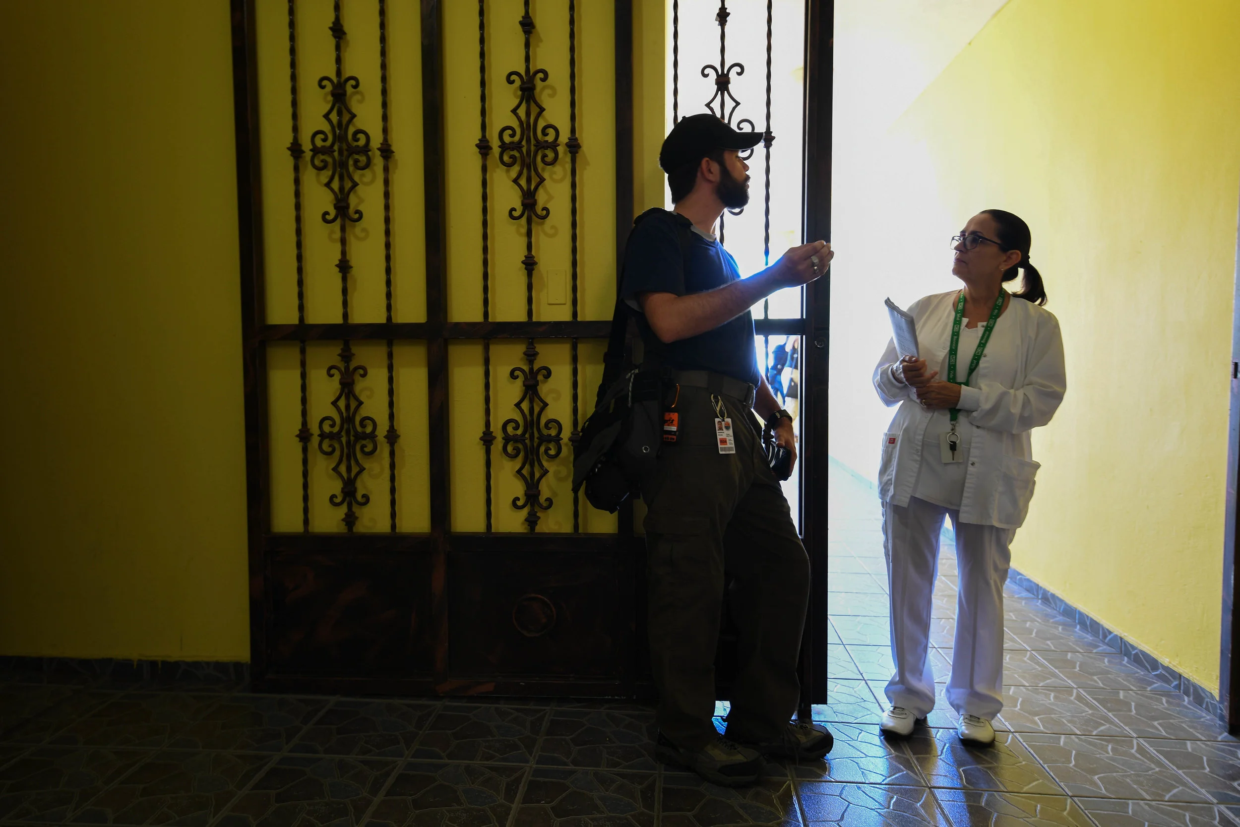 Darrick Kouns tells the head nurse at the Moca hospital that the building will have internet and phone service for the first time since Category 5 Hurricane Maria struck in September.