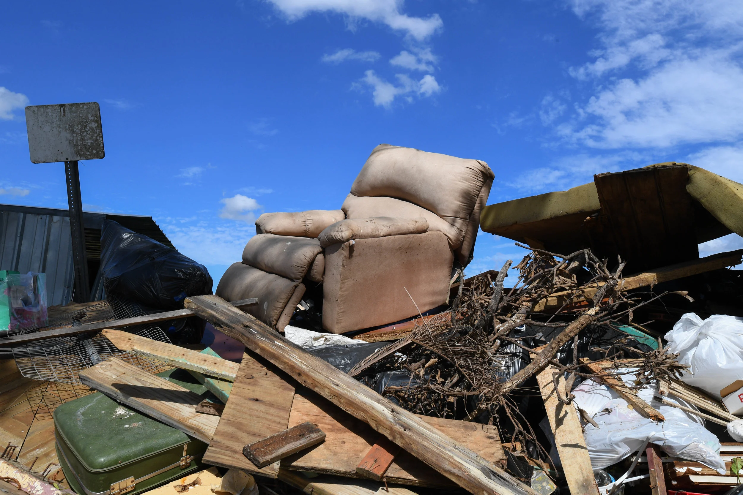 Piles of trash and furniture line the roads of Moca.