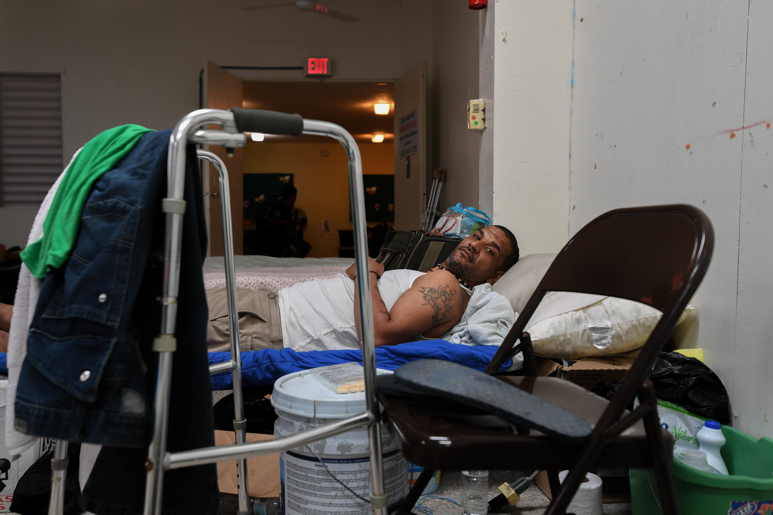  Jose Torres Matos, 36, rests on his cot in a shelter he now calls home in Puerto Rico. 