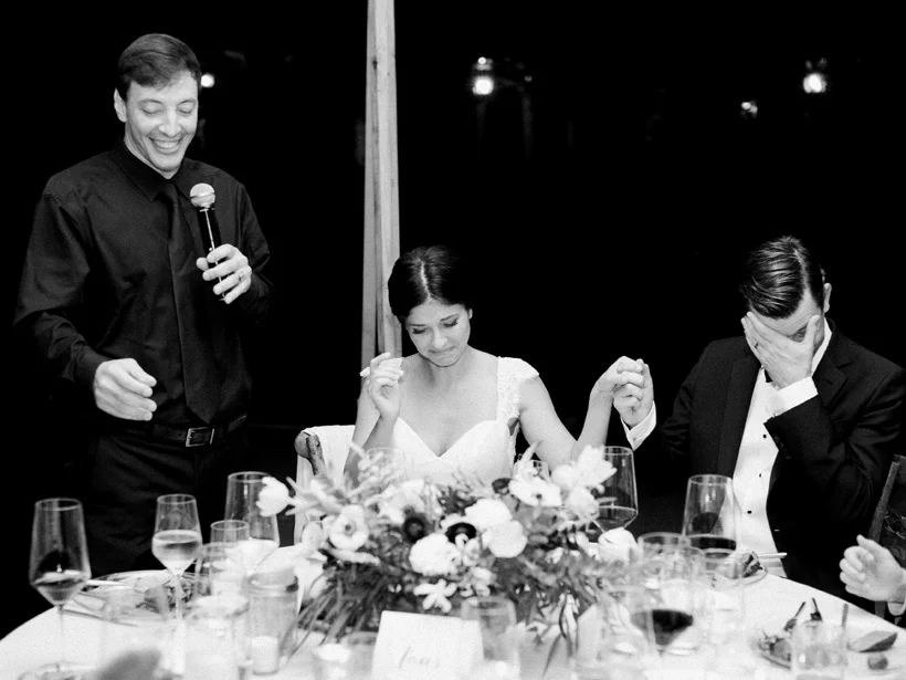 Bride and groom get emotional during her brother's wedding speech. Photo by Kat Braman