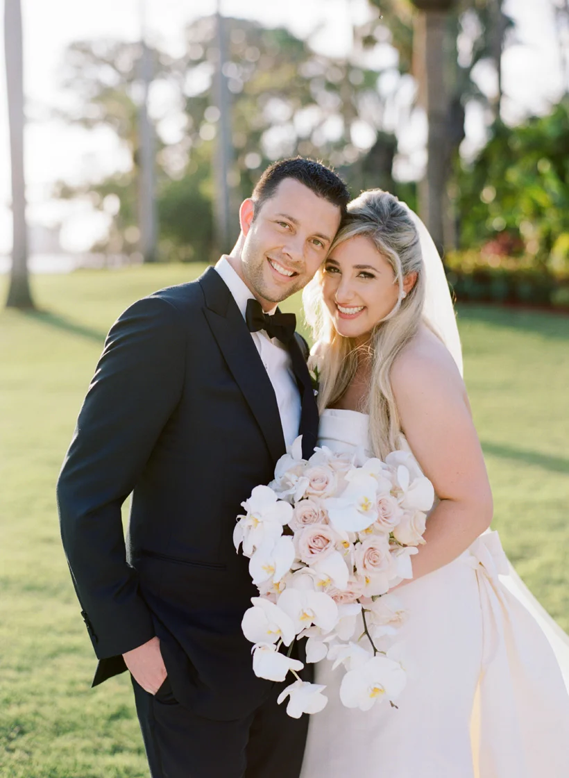 Bride and Groom at elegant Palm Beach wedding. Photo by Kat Braman