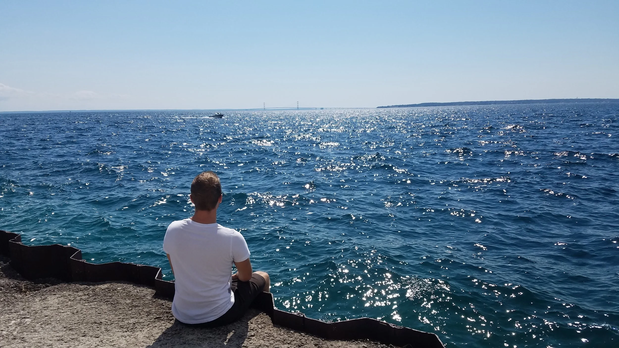 So, I didn't give you a photo of the Grand Hotel or a horse-drawn carriage or the scene on Main Street, and that's shameful. But at least we've got this: a staring-off-into-the-distance shot featuring the Mackinac Bridge .