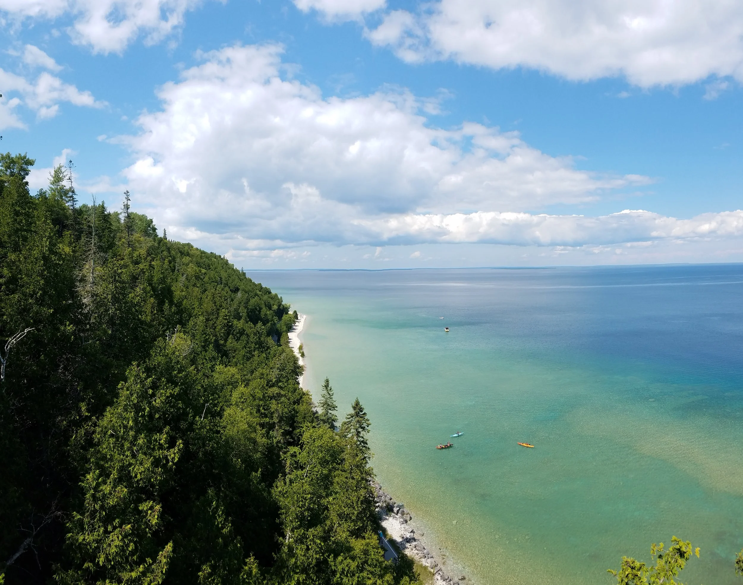 Looking northeast-ish from Mackinac Island's Arch Rock one can see that varying shades of blue and green, with other optional colors intermittently sprinkled in, can make for an eyeball-pleasing experience. Perhaps you'd like to take it all in with a kayak tour from Great Turtle ?