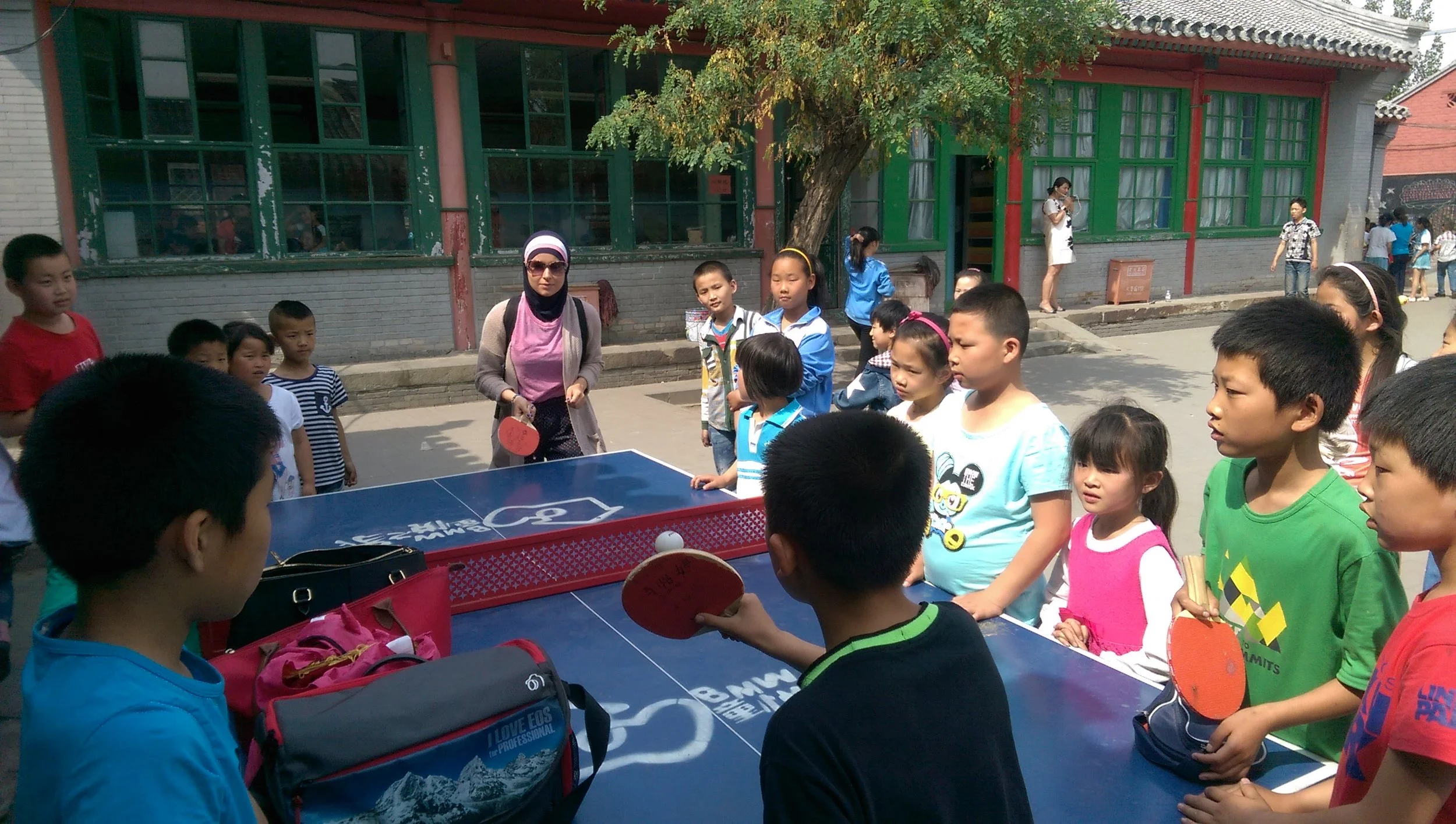 Nadine holds serve at the migrant school