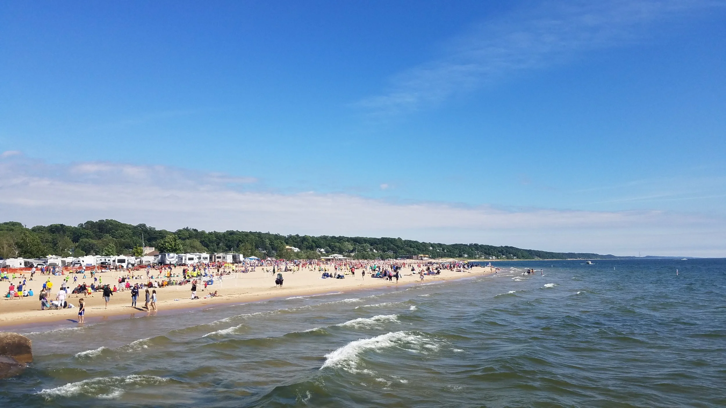 We made our way to the beach at Grand Haven State Park eventually. The day we were in town, there happened to be a gigantic soccer tournament going on. A woman we passed on the beach said there was something like 400 teams participating. Something tells me there would be that many people at the beach in Grand Haven whether there was a huge sports tournament going on or not...