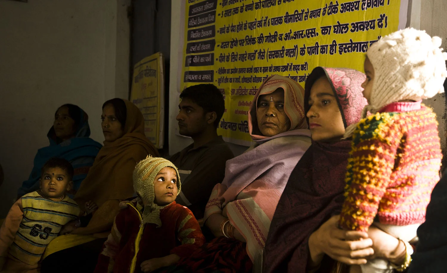 Parents wait with their children at a polio vaccination clinic, Moradabad, India