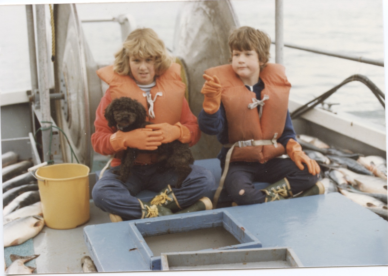 Heather (age 9), Scott (age 7), and their dog Bingo working aboard the F/V AnneLee .