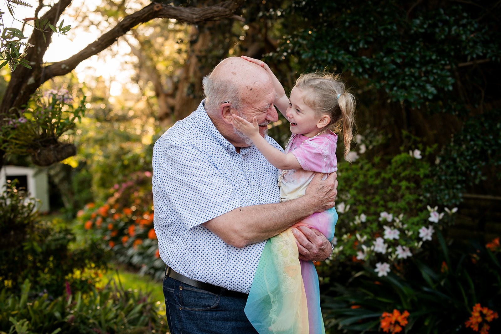 grandfather and grand daughter looking into each others eyes