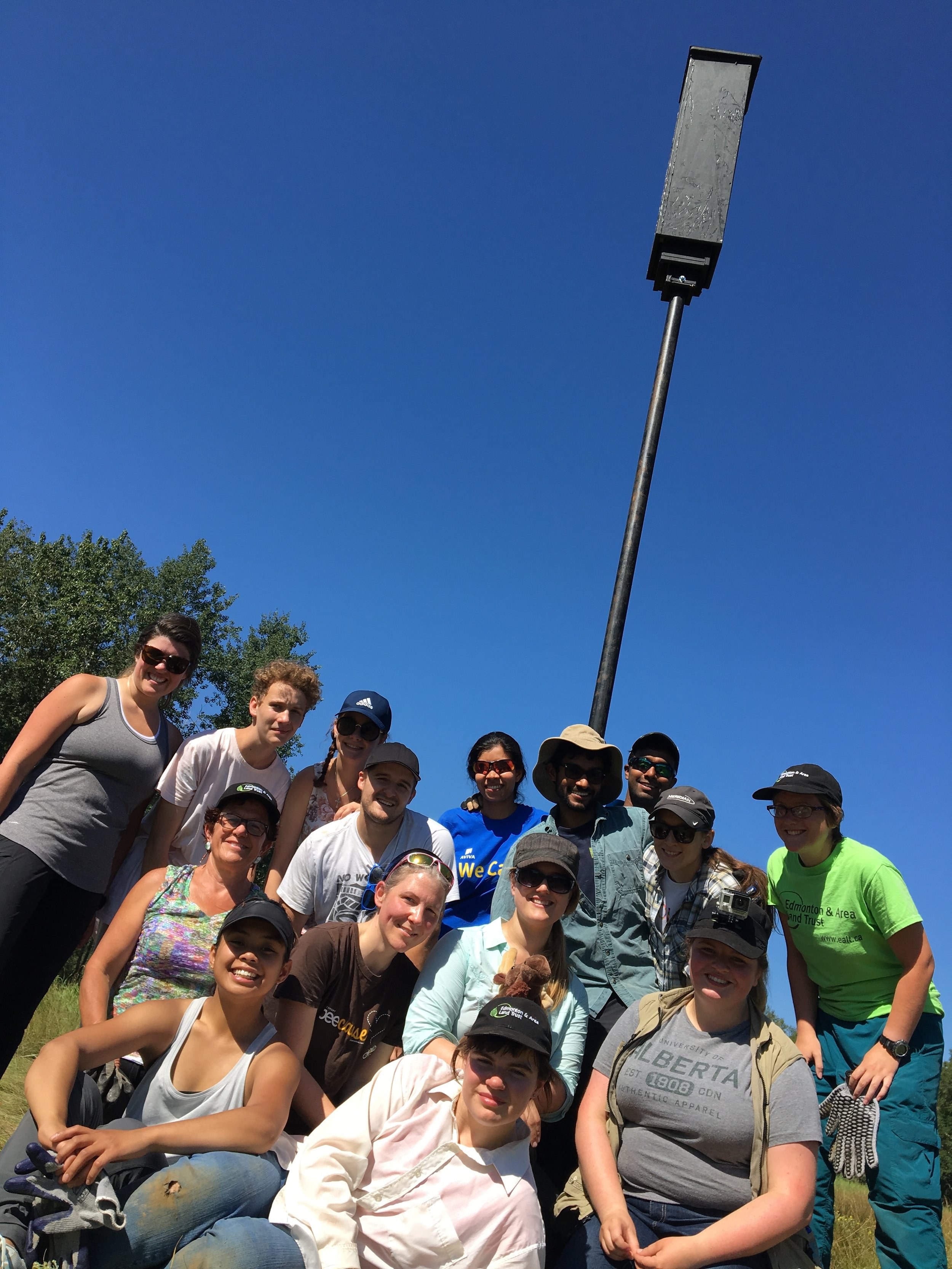 Volunteers with a bat box at Bunchberry Meadows