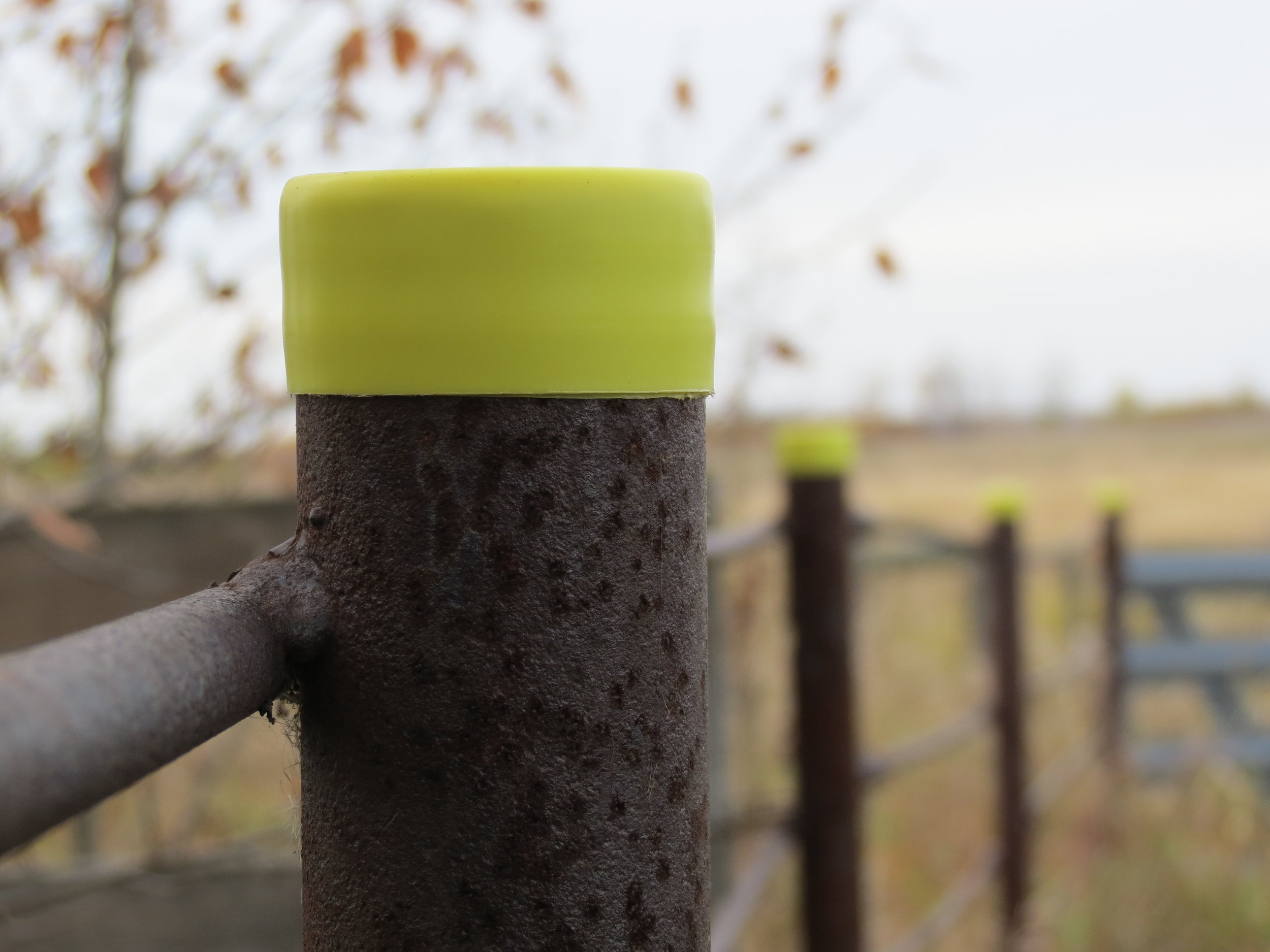 Plastic caps are a simple solution to cover open posts.