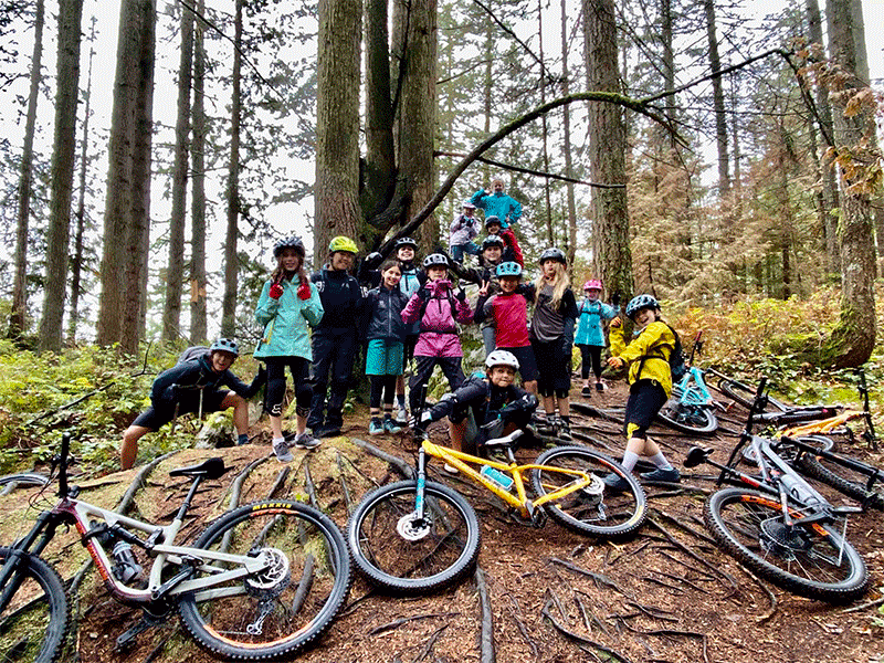 a group of very happy girls, riding mountain bikes!