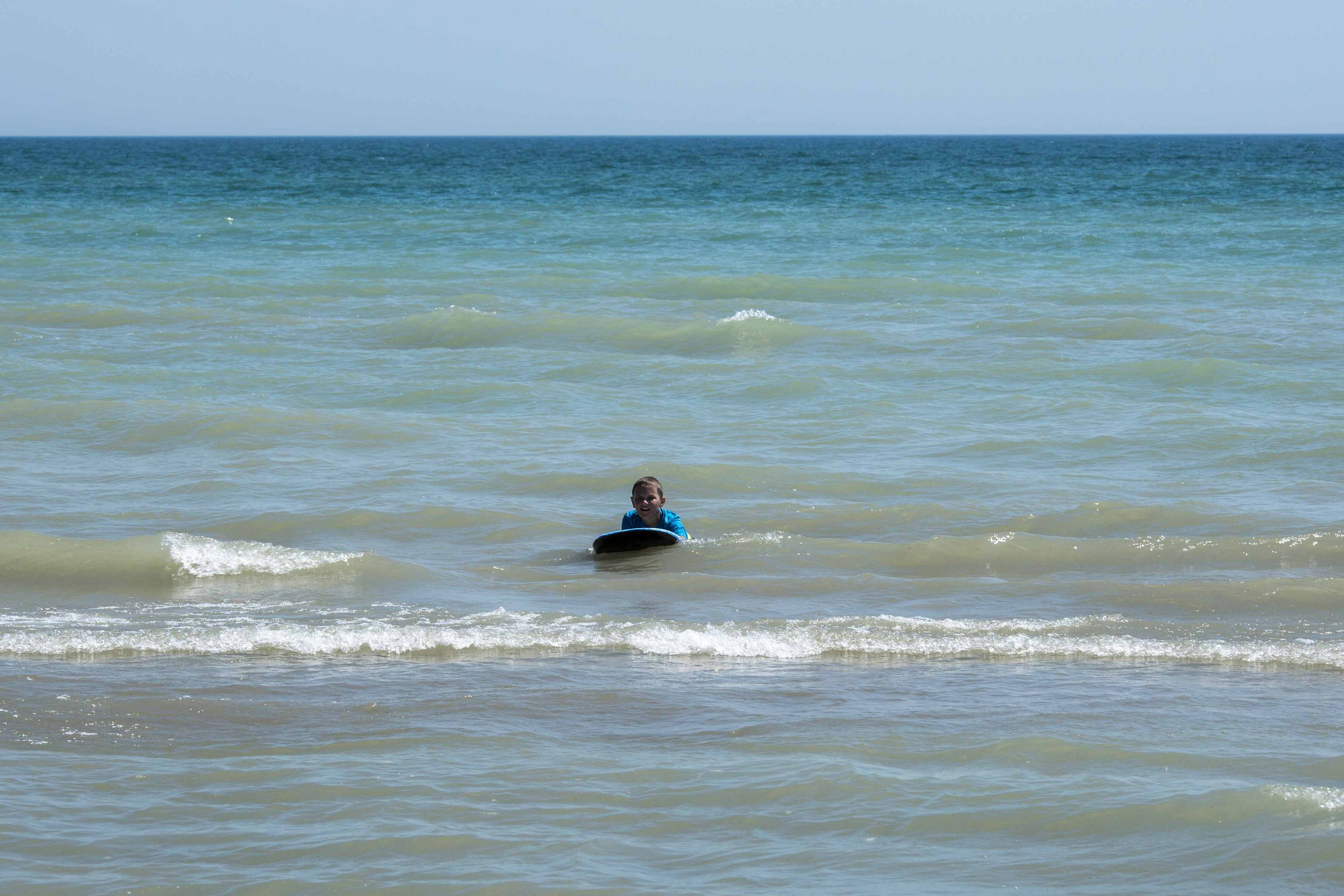 Daniel on his boogie board, Long Point Provincial Park, Ontario, Canada - Photo by Todd Sechel