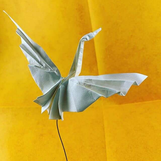 This is the dancing crane designed by @triangleorigami folded from a triangle of leather paper from @origamishopdotus .This is an amazing model!!and I understand that it is pretty simple but how elegant you can make it look makes all the difference!!