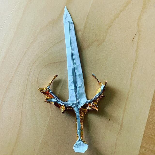 This is my second attempt at @triangleorigami sword folded from a six inch sheet of Japanese foil!Have a good day!!