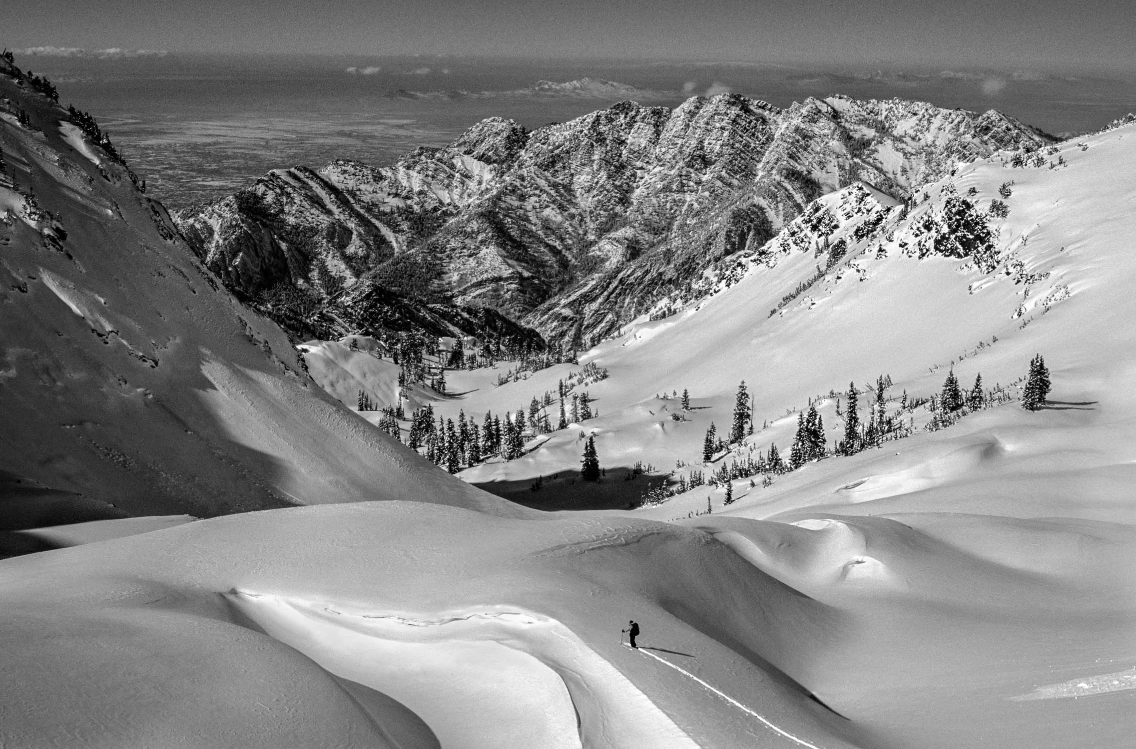 "Breaking trail in Big Cottonwood". Black and White photograph B &amp; W of Solo Backcountry Skier in Twin Peaks Wilderness, Utah