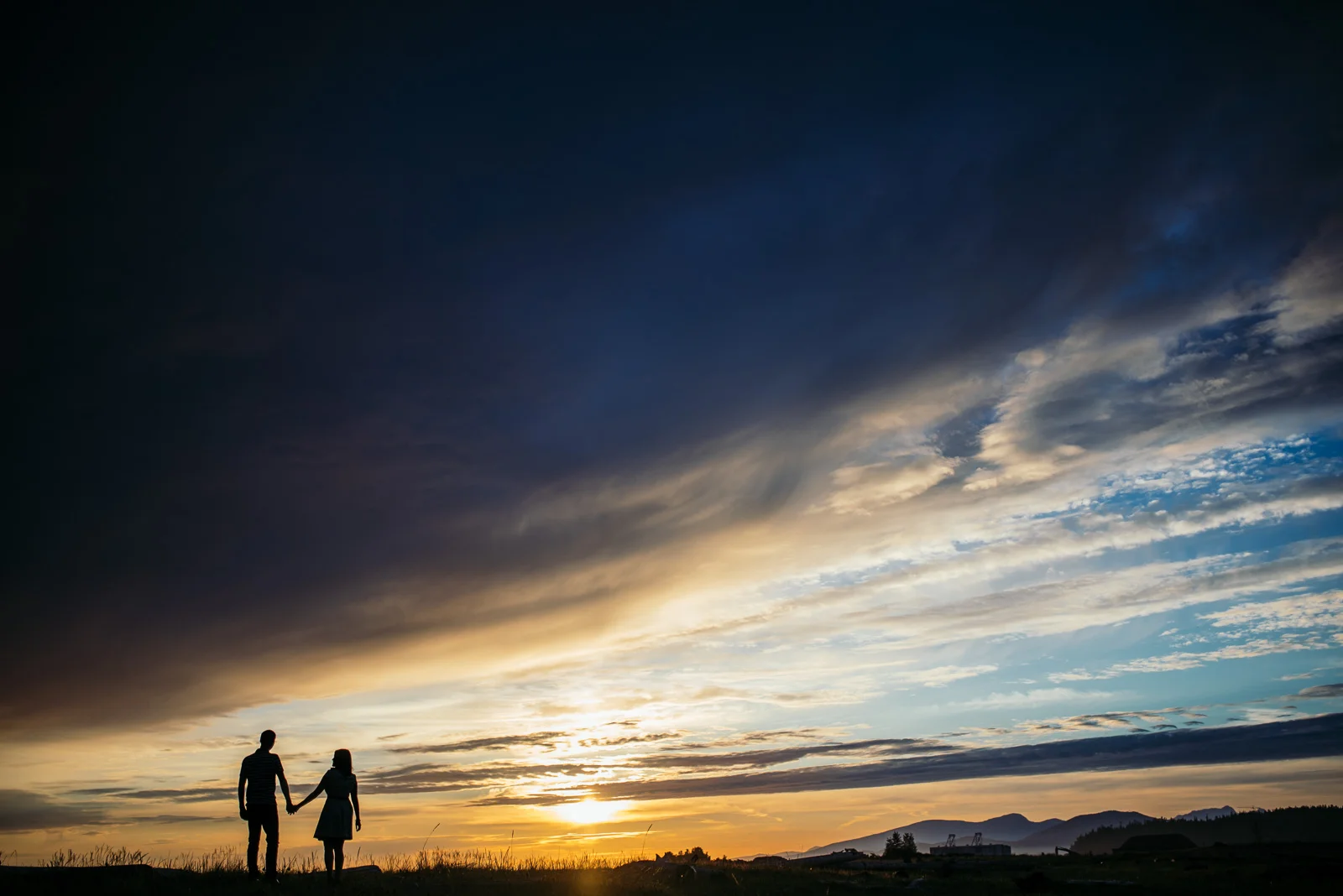 ^ I mentioned it above, but I’ll say it again…I’m a sucker for silhouettes! During Aaron and Ramiza’s engagement shoot at Iona Beach, we were gifted with just a ridiculous sunset with awesome dark clouds and bright colours. I asked them to walk up onto the grassy ridge and watch the sunset, and this was the resulting photo.