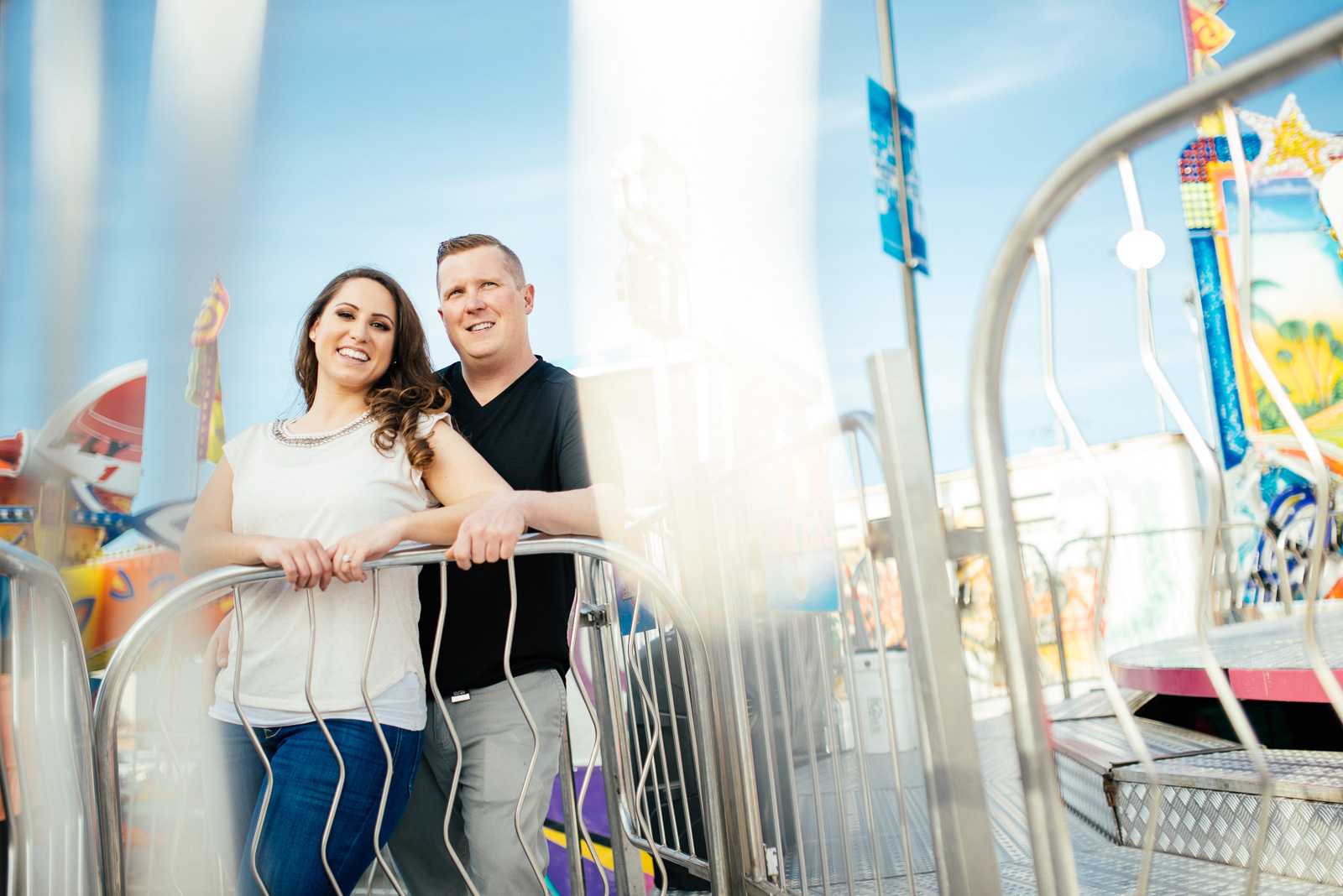   ^ Tanya &amp; John were one of our most fun-loving couples this year, so it was only suiting that we did their engagement photos at an amusement park! &nbsp;The story behind this image is that the amusement park we chose was a very small mobile par