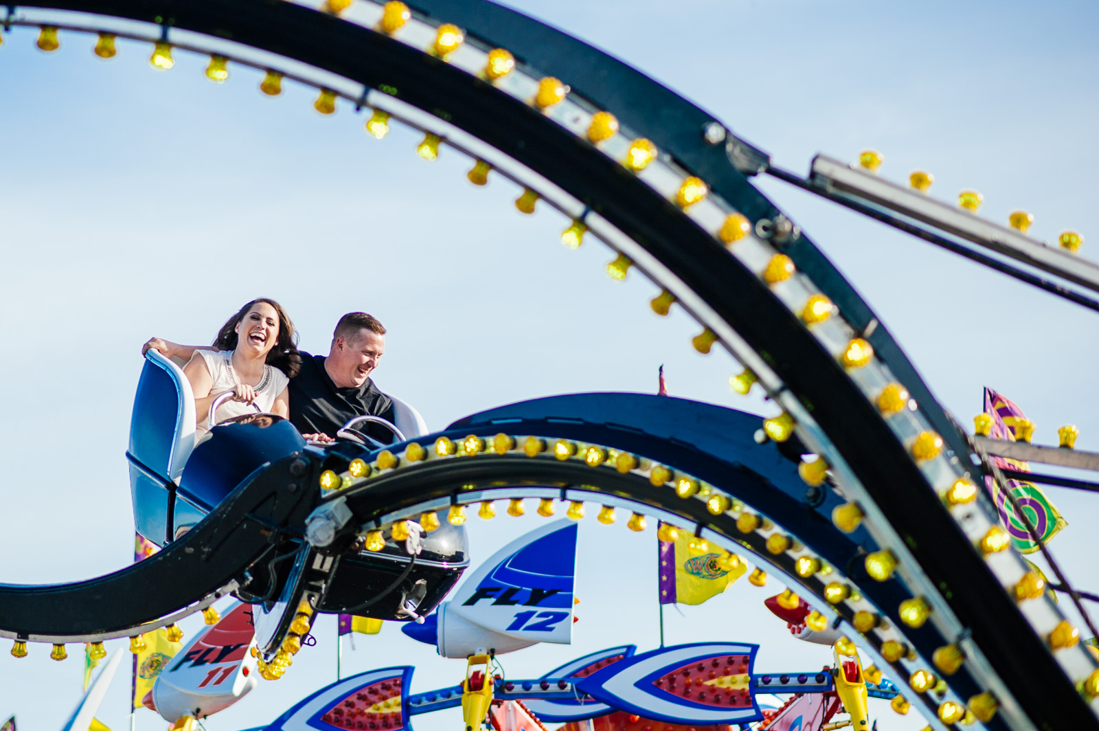  ^ “Finishing on a (up-) high note.” Tanya and John were arguably our most goofy couple. &nbsp;In lieu of cuddly and kissy photos, they wanted a fun-loving carnival engagement session that really highlighted their love of laughter. &nbsp;We were tota