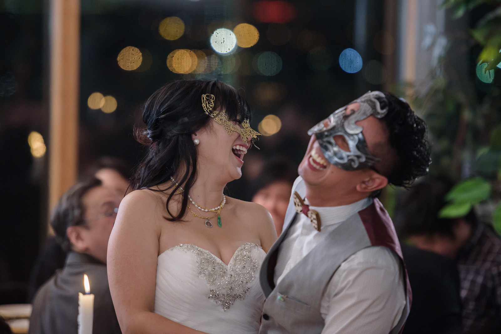 couple laughing at masquerade wedding at ubc boathouse in richmond bc - victoria wedding photographer