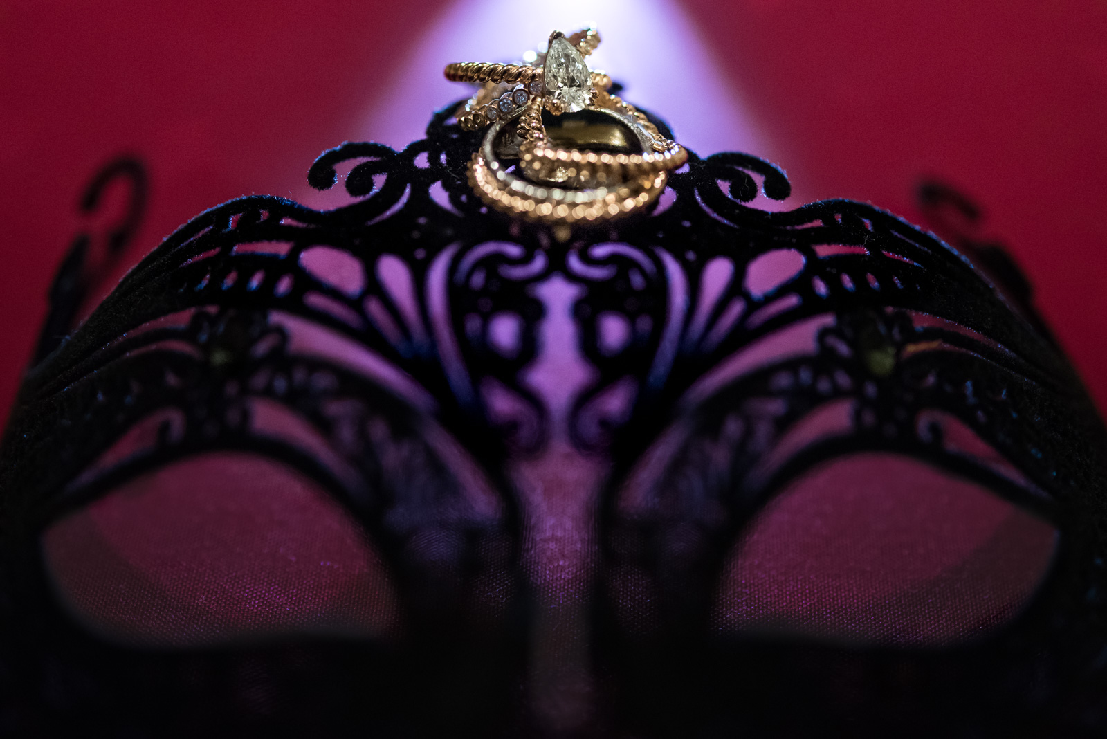 wedding rings on a black lace mask at masquerade wedding at ubc boathouse in richmond bc - victoria wedding photographer