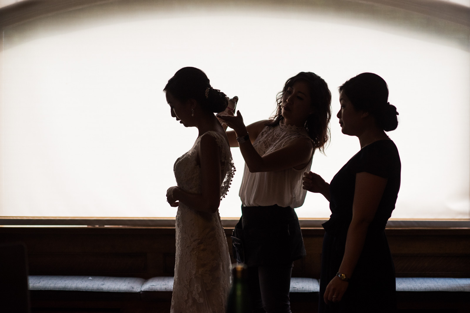 bride getting ready for wedding at cecil green park house on ubc campus in vancouver - victoria wedding photographers