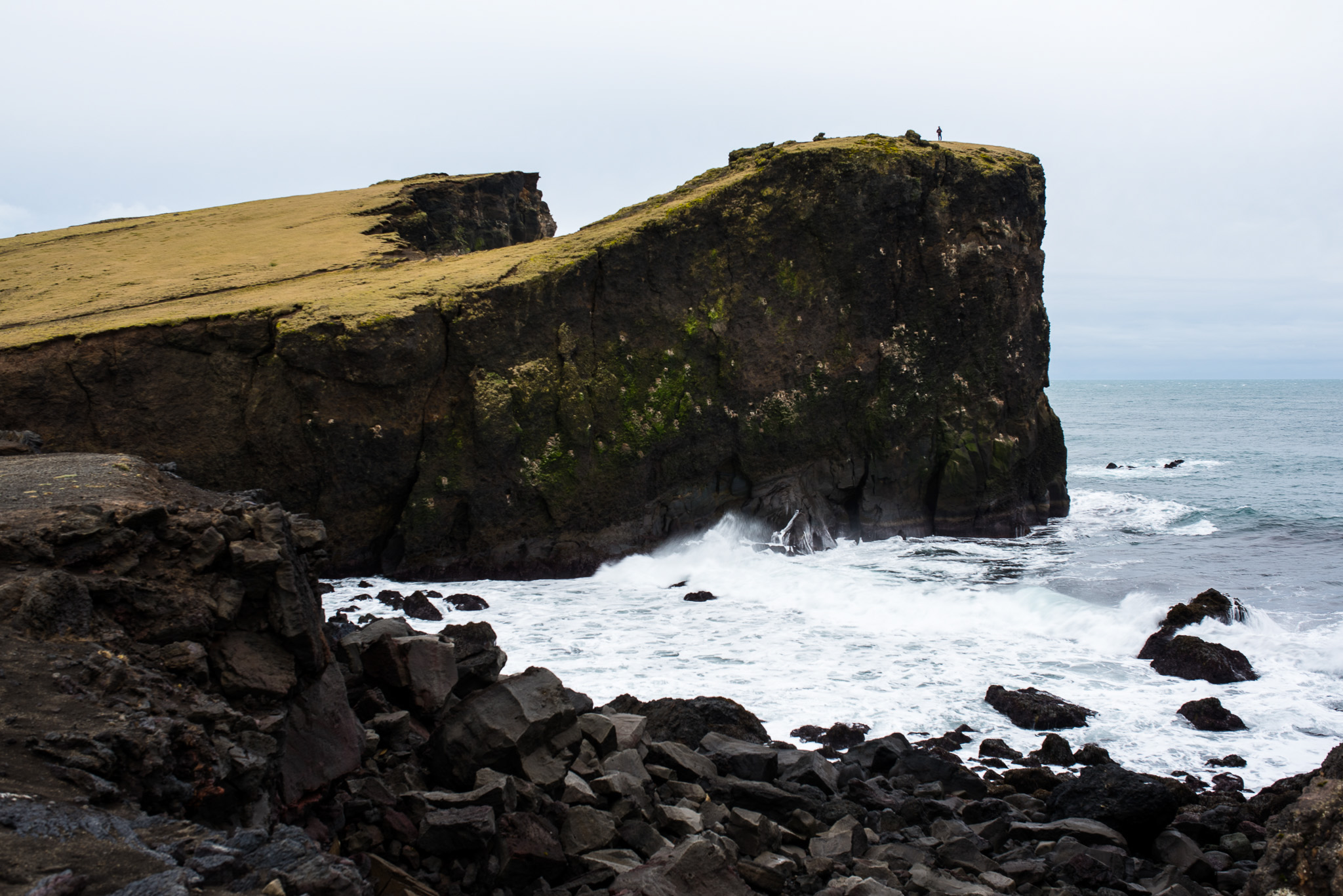 Tiny man, big cliffs.