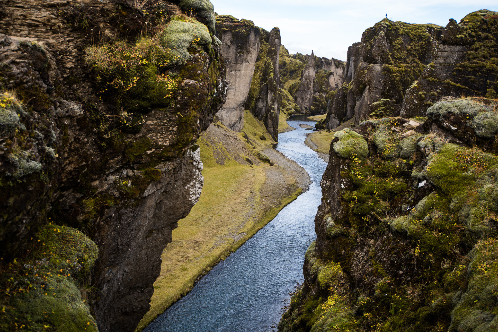 Tiny Sayde perched on canyon cliffs.