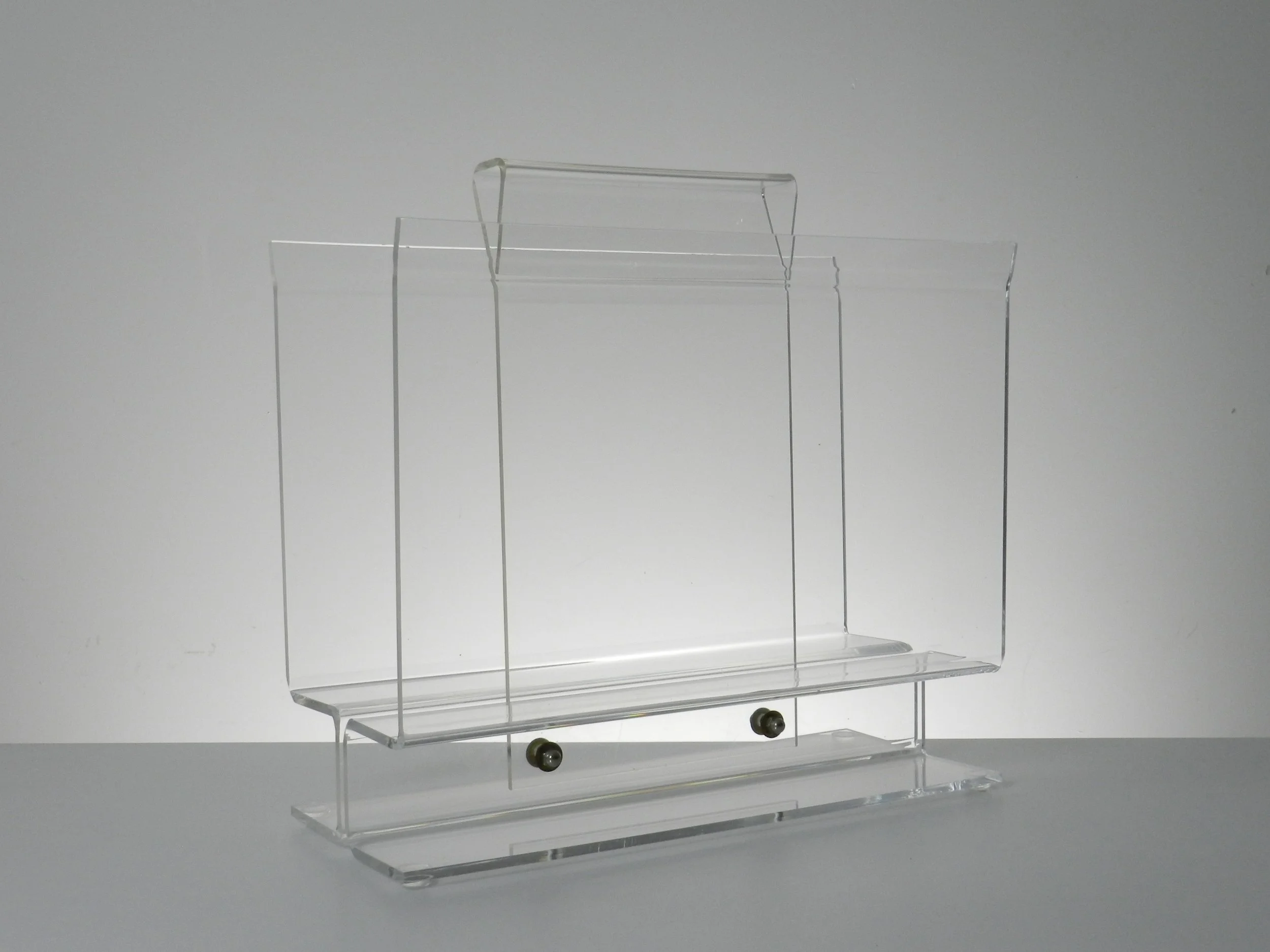 Vintage modernist lucite magazine rack.  circa 1980s.