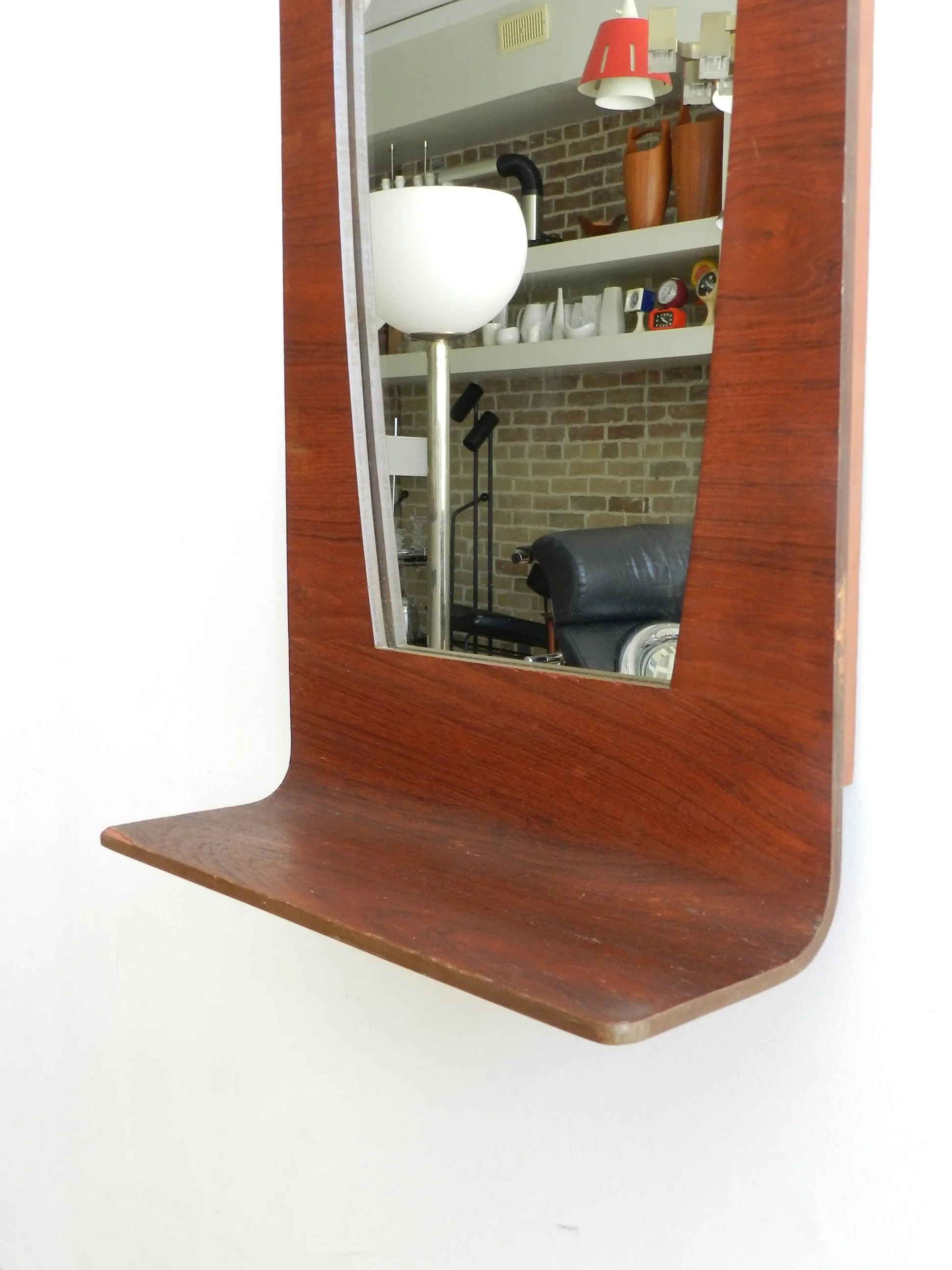 Bent plywood with teak veneer entry wall mirror with shelf.  Canada, 1960s.