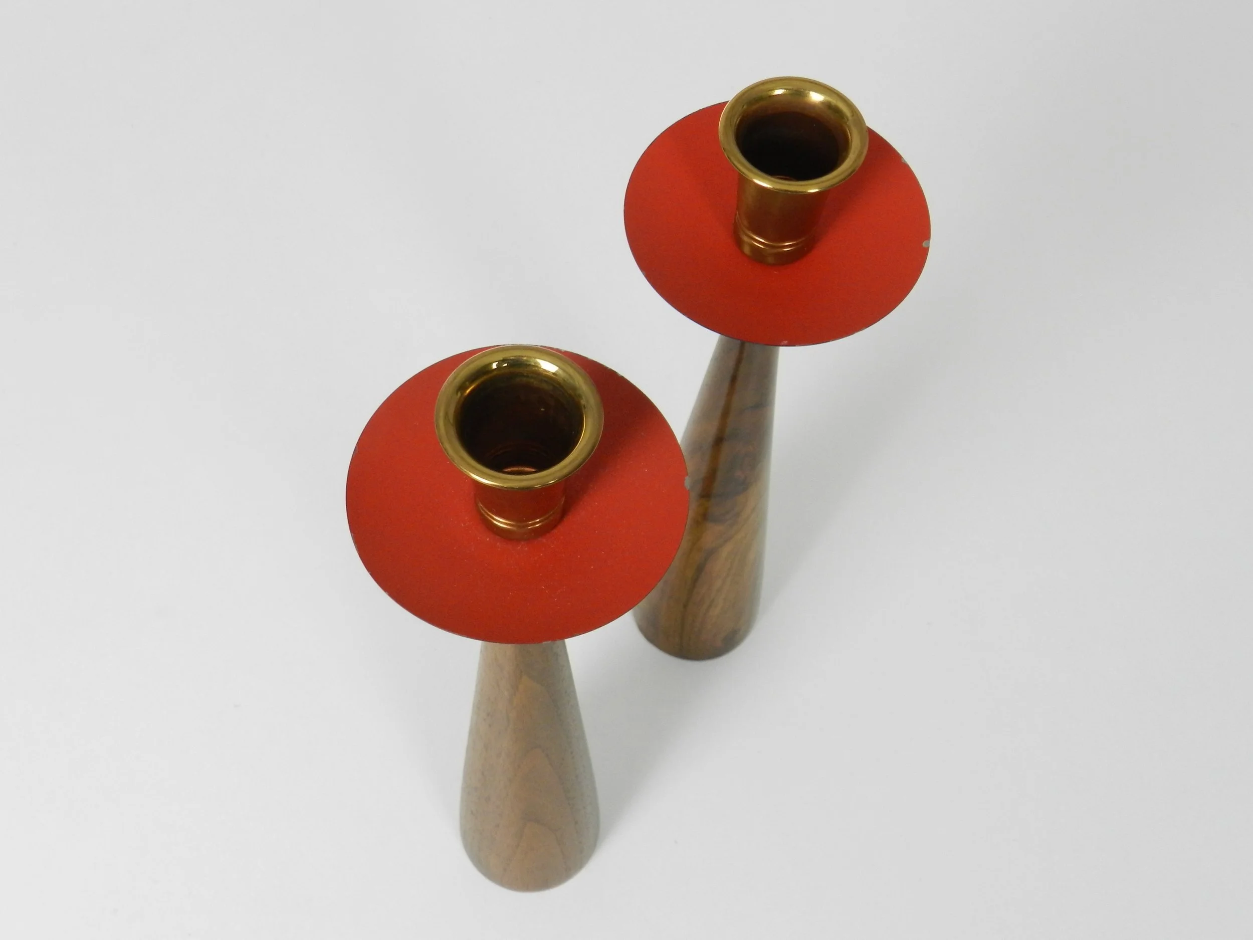 Mid century candle holders in walnut, brass and enameled metal.  Denmark, 1960s.