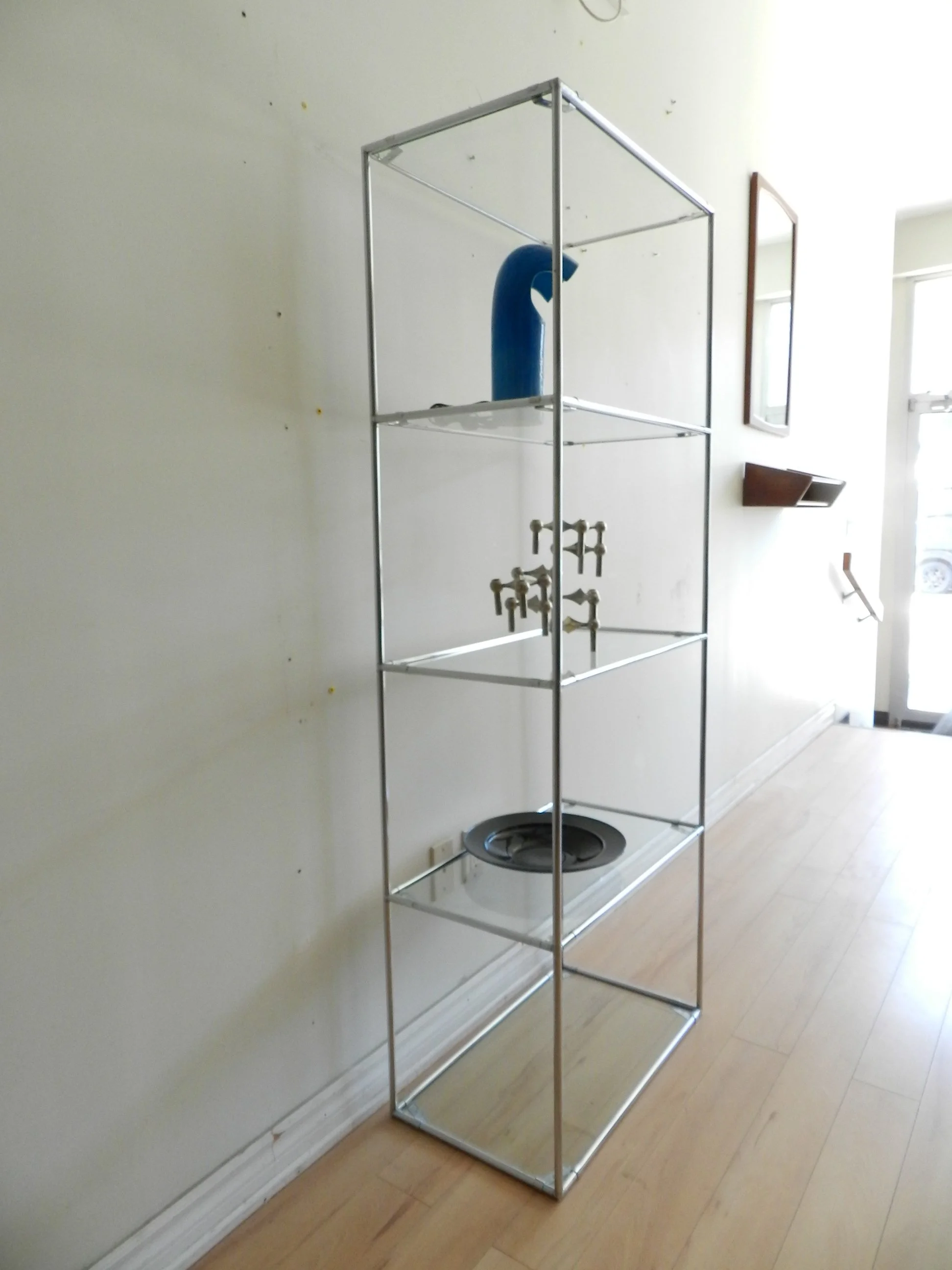Pair of Abstracta chrome and glass modular shelf units designed by Poul Cadovius for Royal System.  Denmark, 1970s.