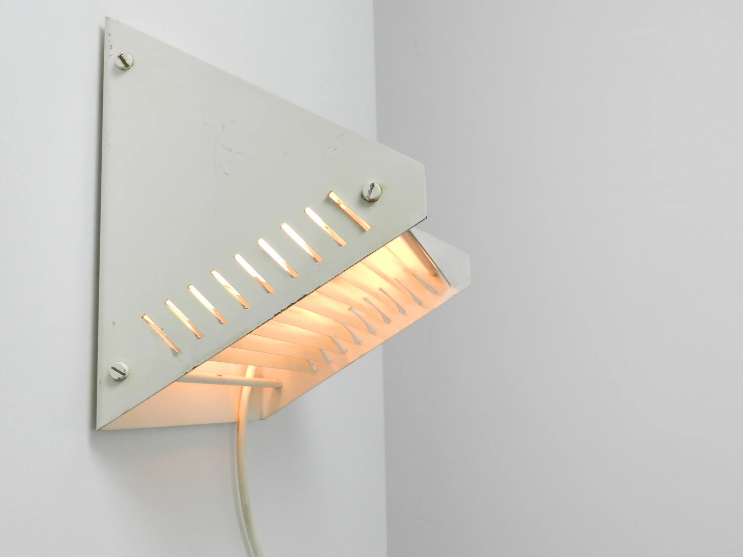 Mid century modern rare wall lamp by Raak.  Netherlands, 1960s.