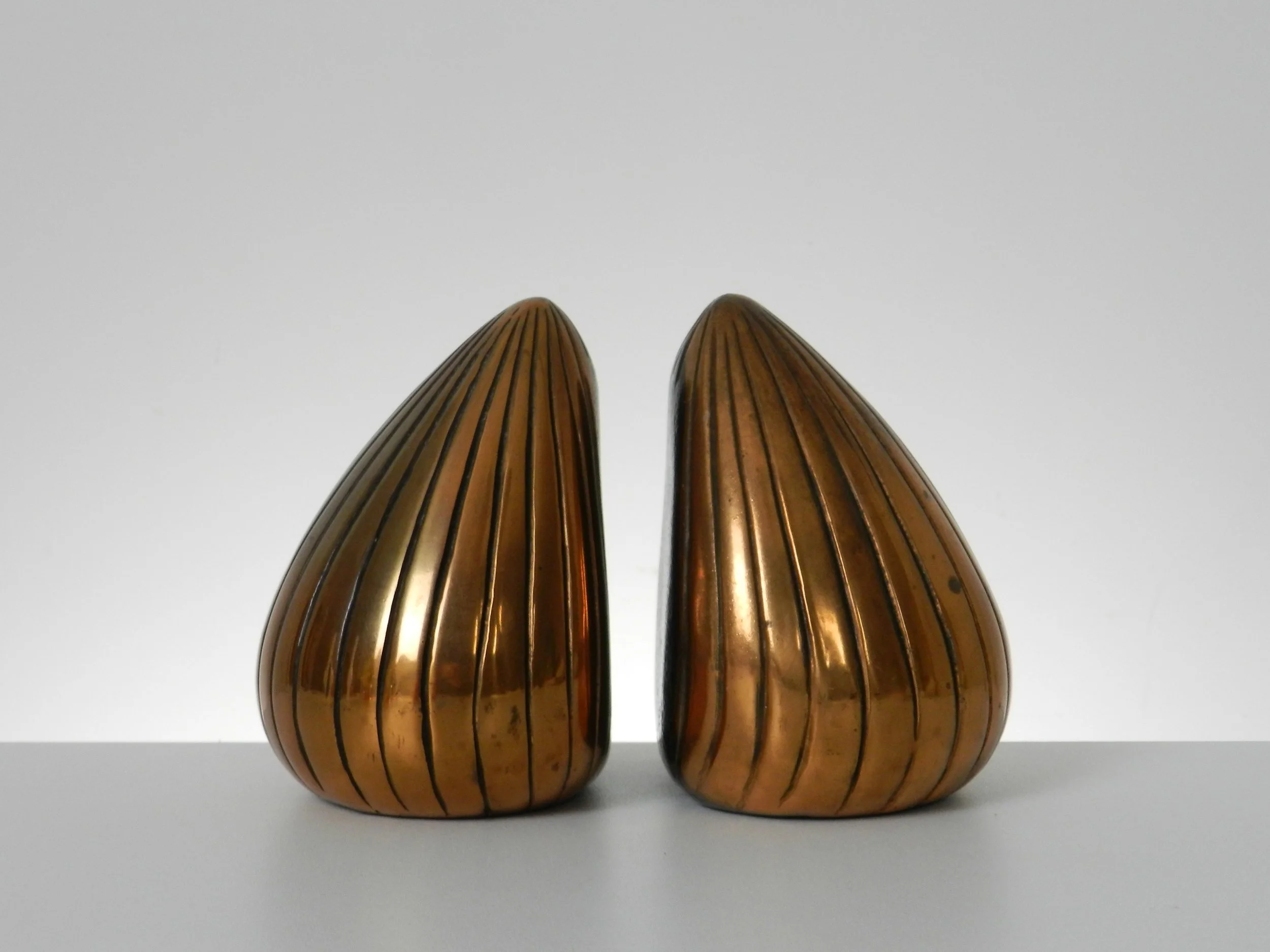 Mid century clam shell bookends designed by Ben Seibel for Jenfred Ware.  USA, 1960s.