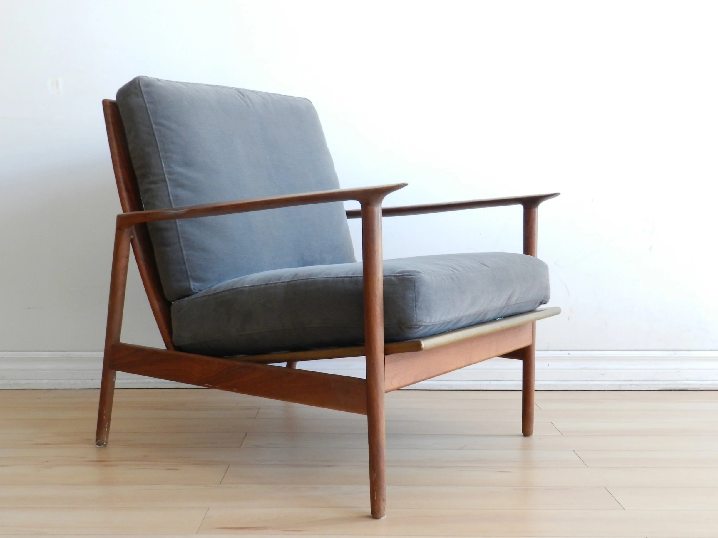 Teak lounge chair designed by Ib Kofod Larsen for Selig.  Denmark, 1960s.
