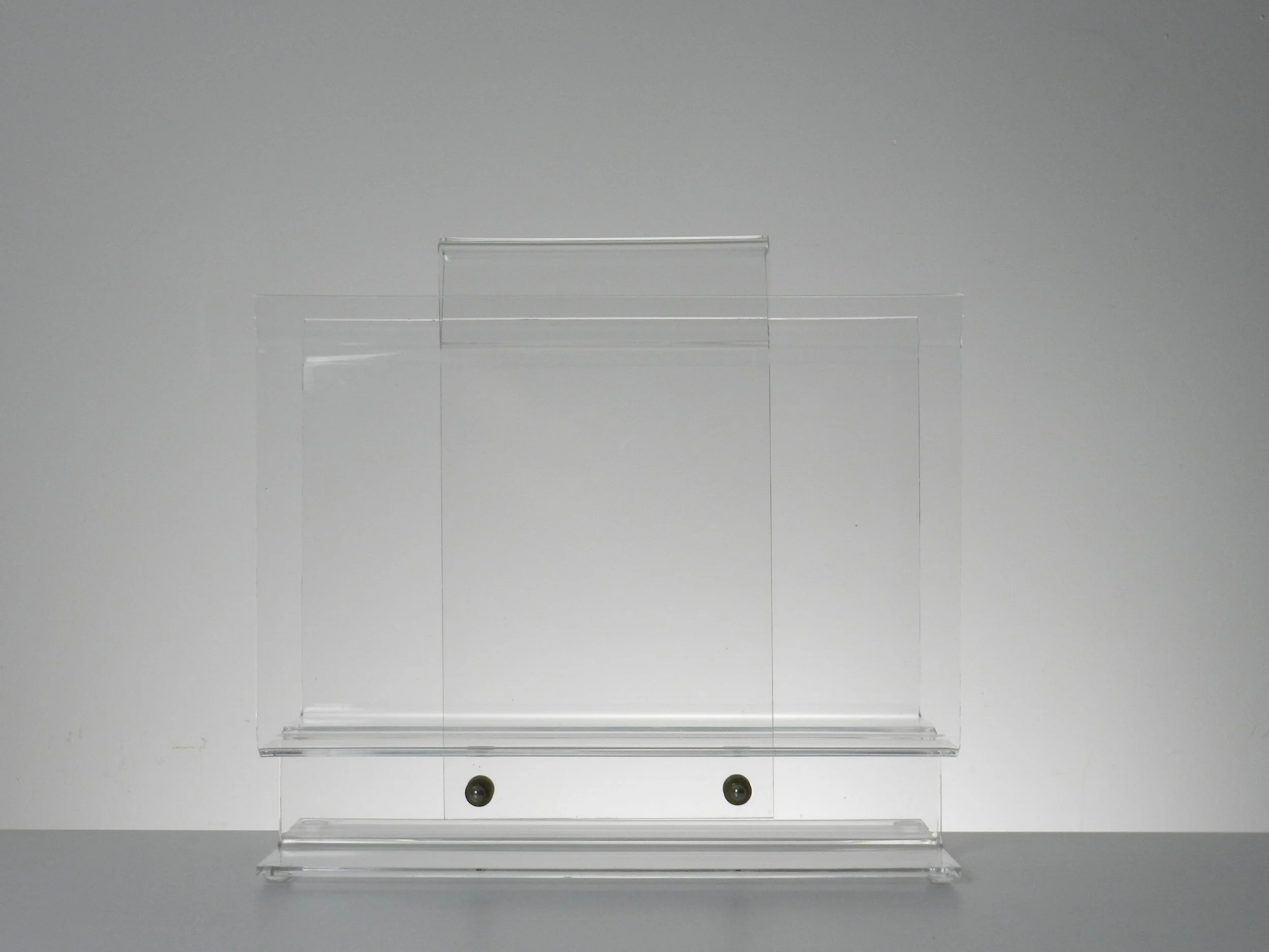 Vintage modernist lucite magazine rack.  circa 1980s.