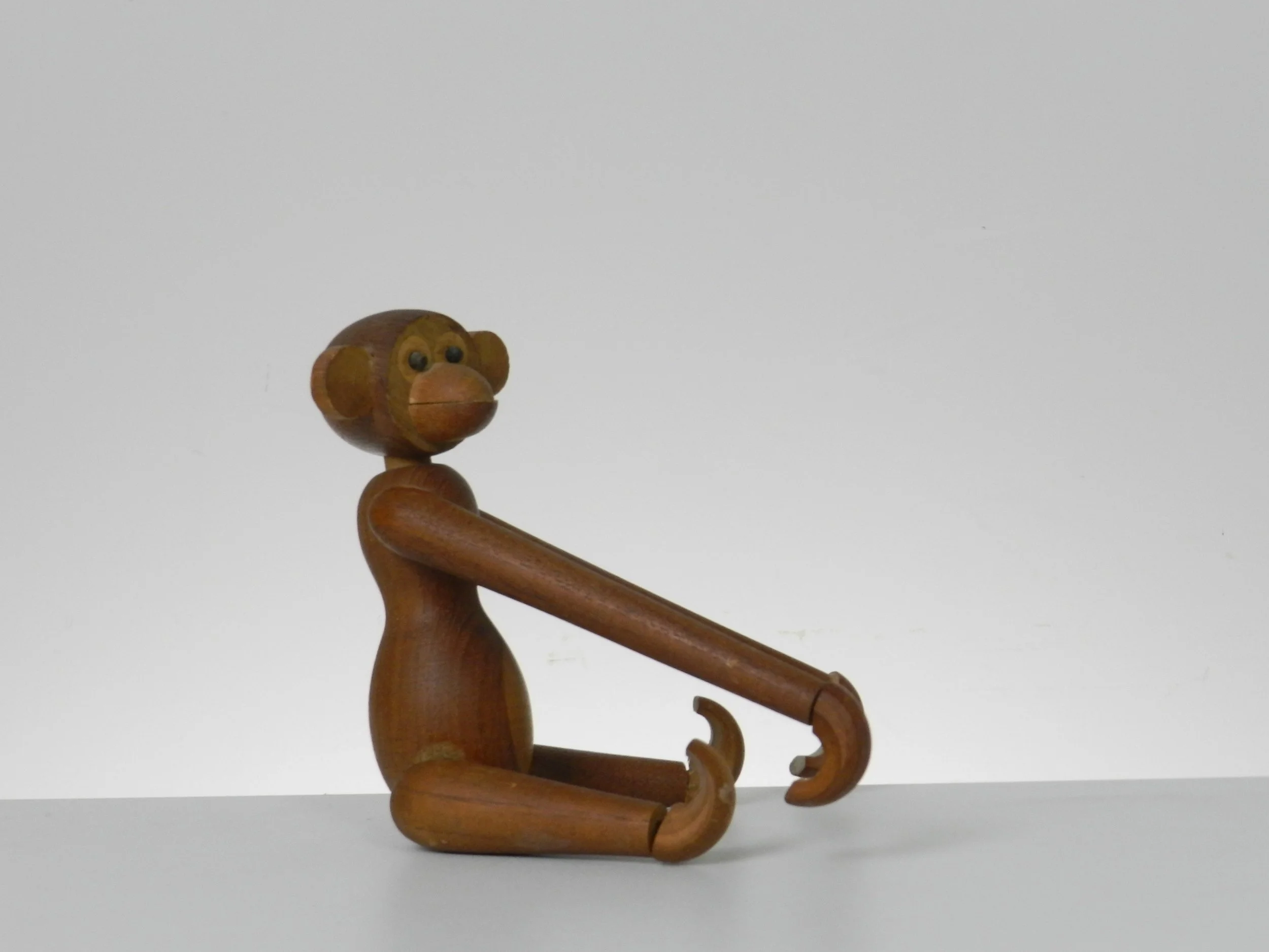 Vintage teak monkey in the style of Kay Bojesen.  circa 1960s.