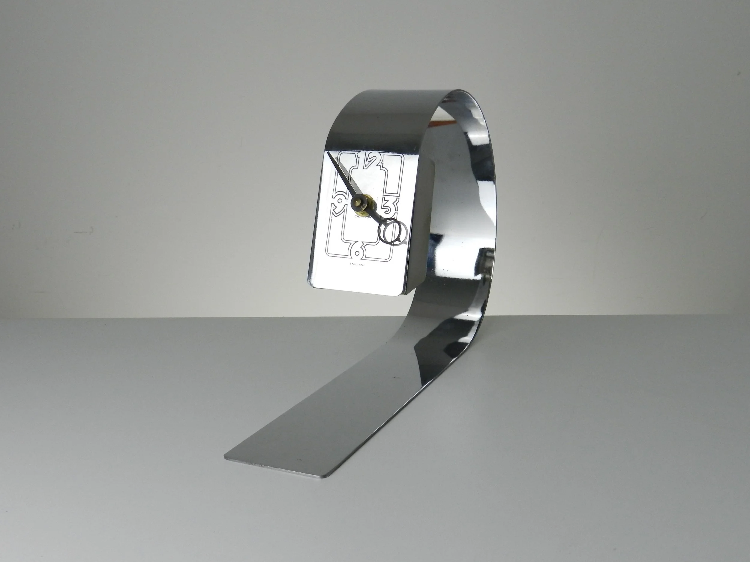 Space age desk clock in chromed steel.  England, 1970s.