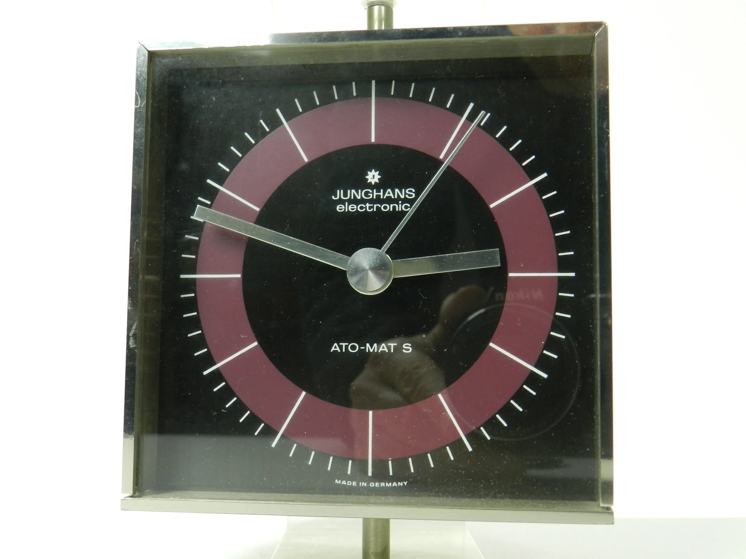 Modernist clock in steel and lucite by Junghans. Table top or wall mounted.  Germany, 1970s.