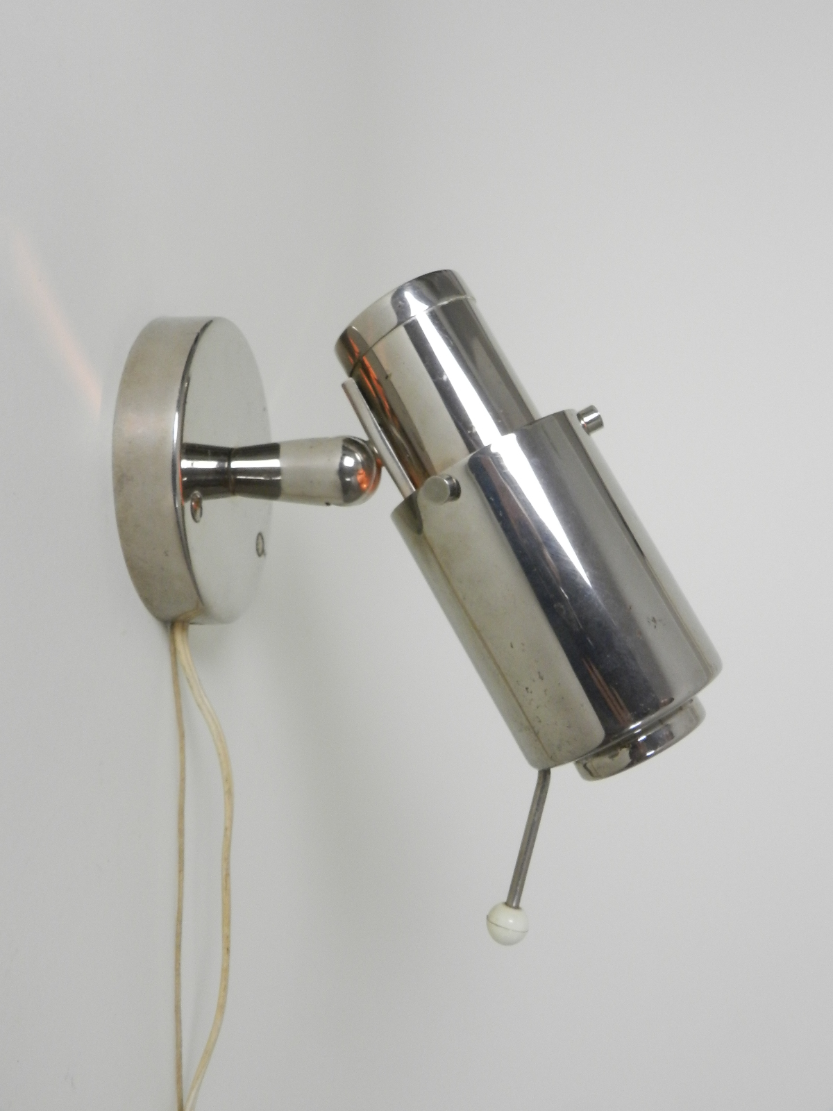 "Zodiaque" spot lamp in chrome metal with glass lens.  Designed by Jacques Biny for Lita.  France, 1950s