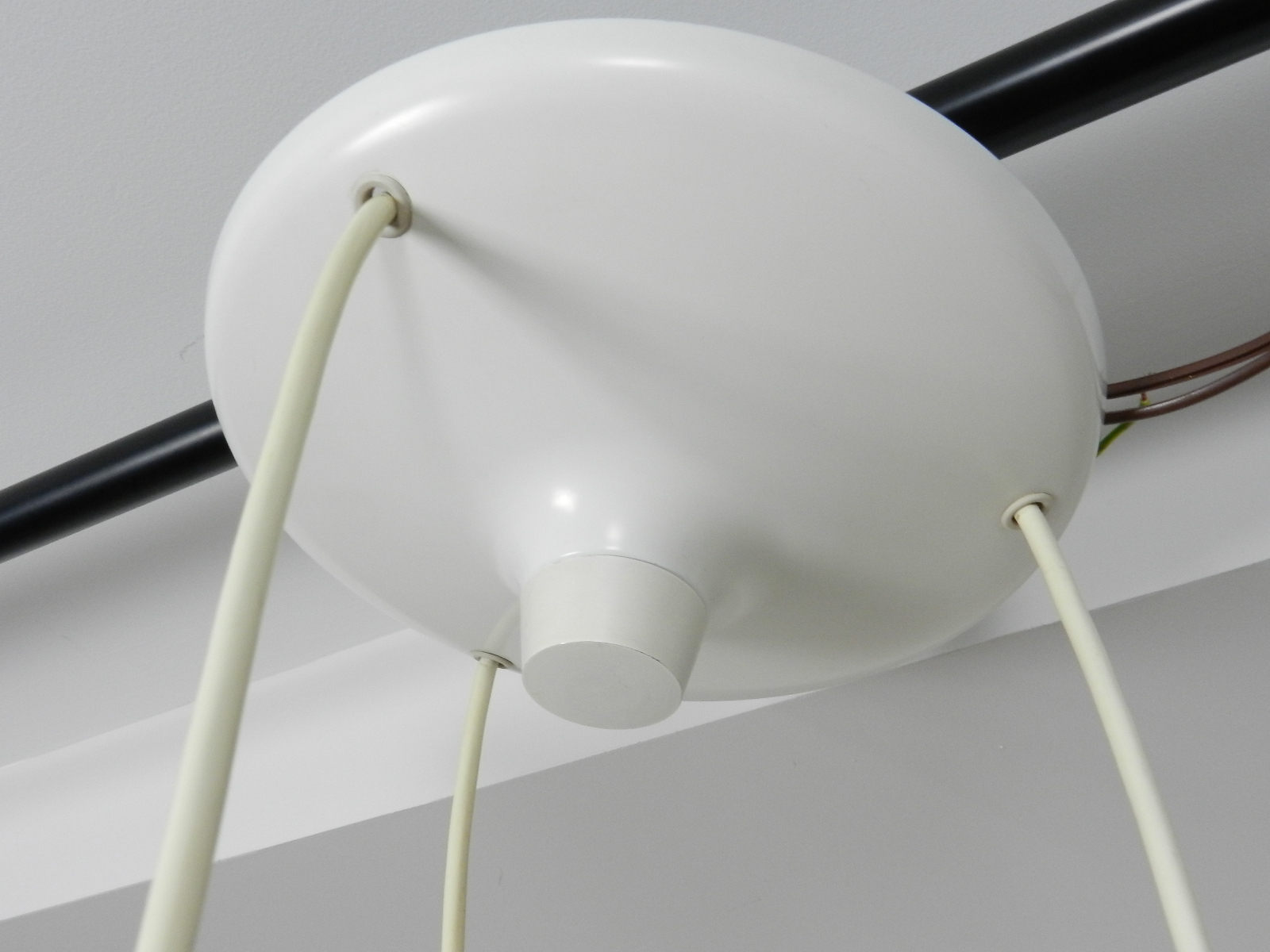 Cascade light fixture in white enameled metal.  Designed by Klaus Hempel for Kaiser.  Germany, 1970s.