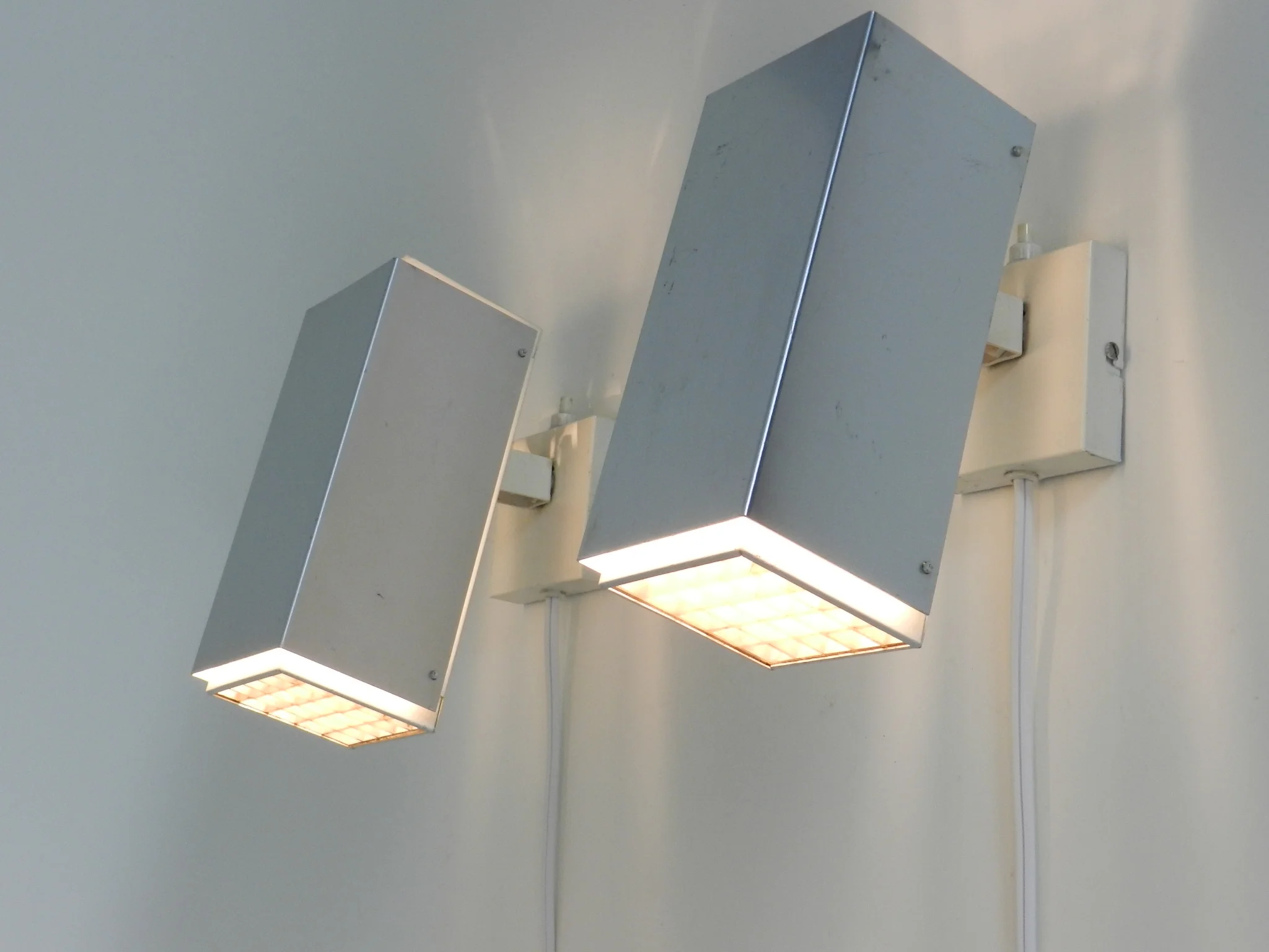 Pair of wall lamp in aluminum and painted metal with plastic waffle diffussers.  Designed by Preben Dal  Denmark, 1960s.