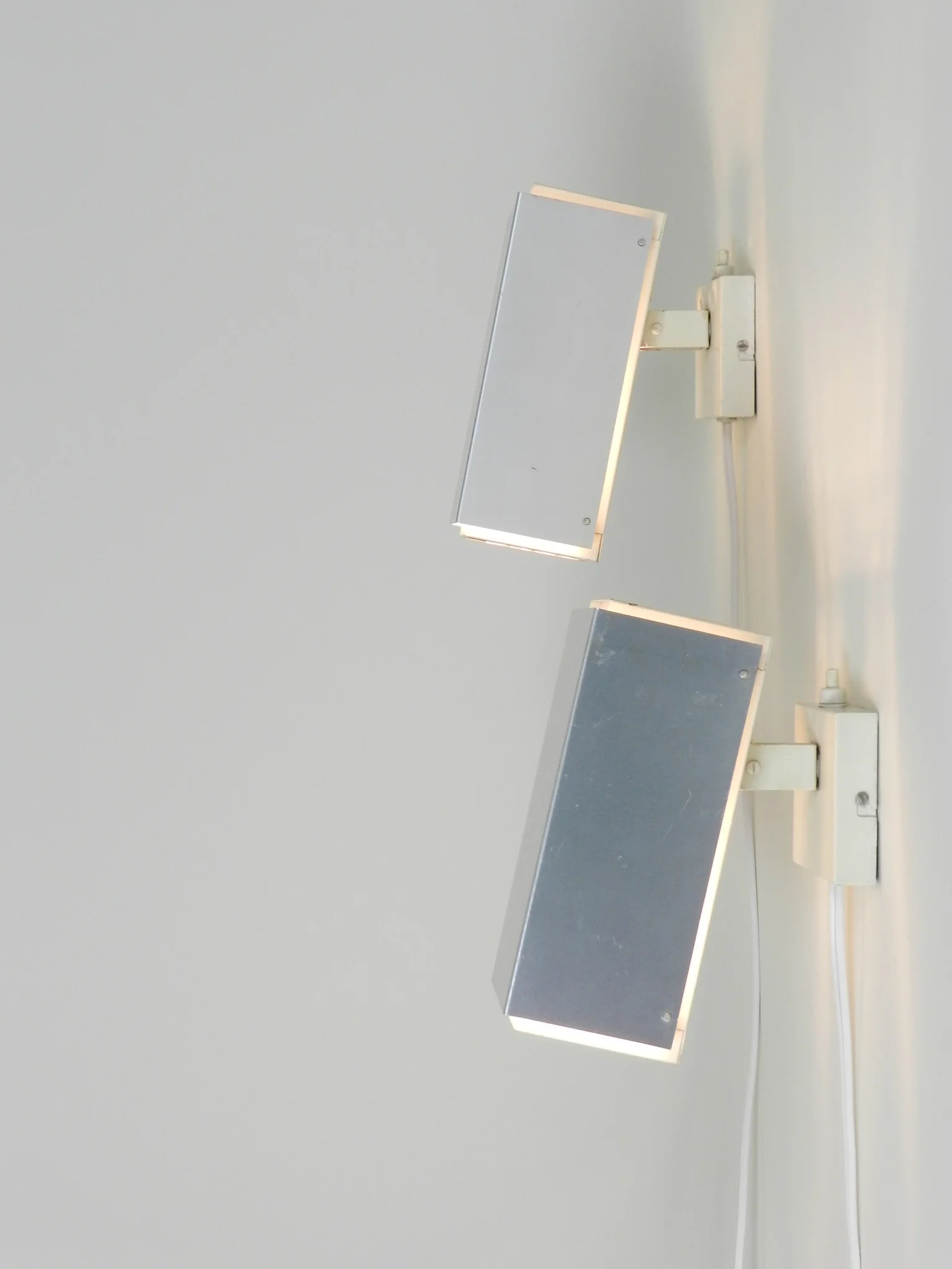 Pair of wall lamp in aluminum and painted metal with plastic waffle diffussers.  Designed by Preben Dal  Denmark, 1960s.