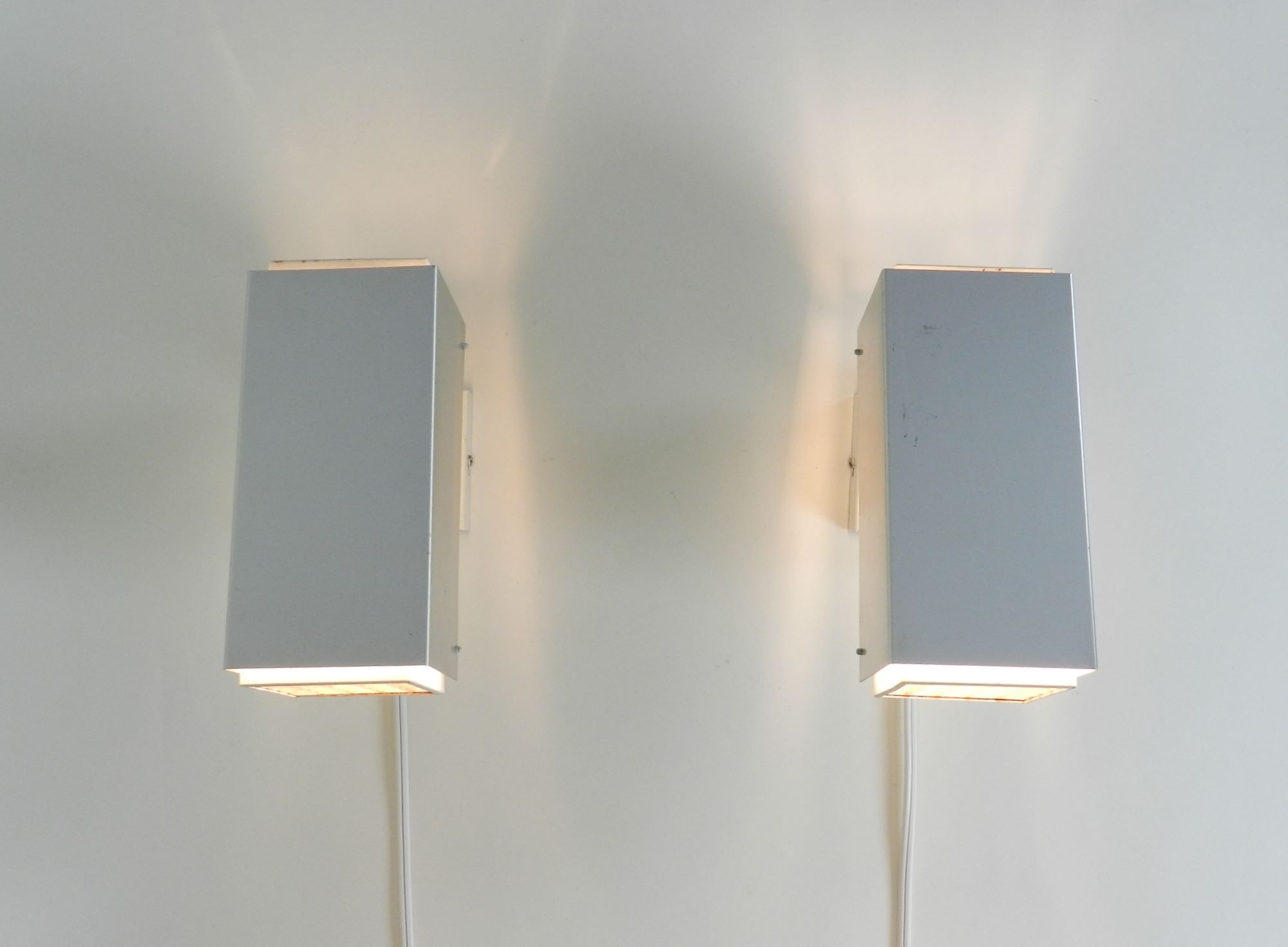 Pair of wall lamp in aluminum and painted metal with plastic waffle diffussers.  Designed by Preben Dal  Denmark, 1960s.