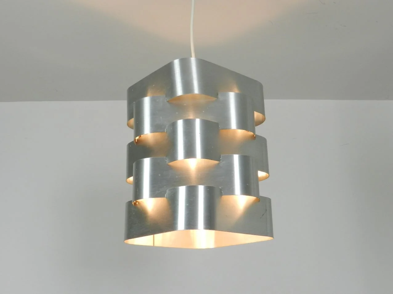 Pendant lamp with 5 interlocking aluminum bands designed by Max Sauze  France, 1970s.