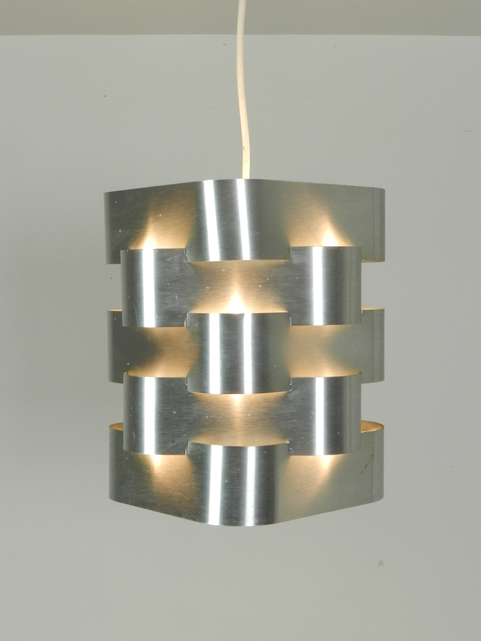 Pendant lamp with 5 interlocking aluminum bands designed by Max Sauze  France, 1970s.