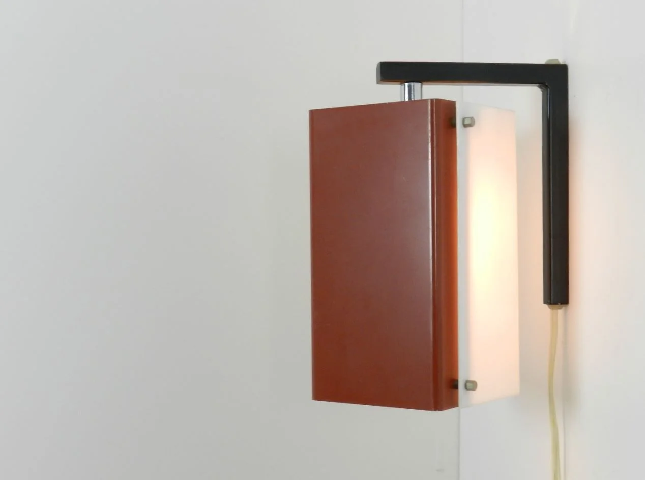 Wall lamp with pivoting shade in enameled metal and acrylic.  Netherlands, 1960s.