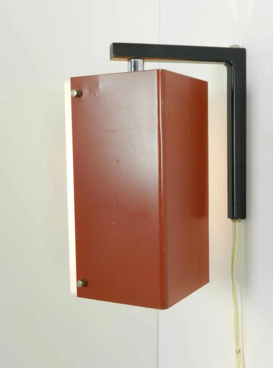 Wall lamp with pivoting shade in enameled metal and acrylic.  Netherlands, 1960s.